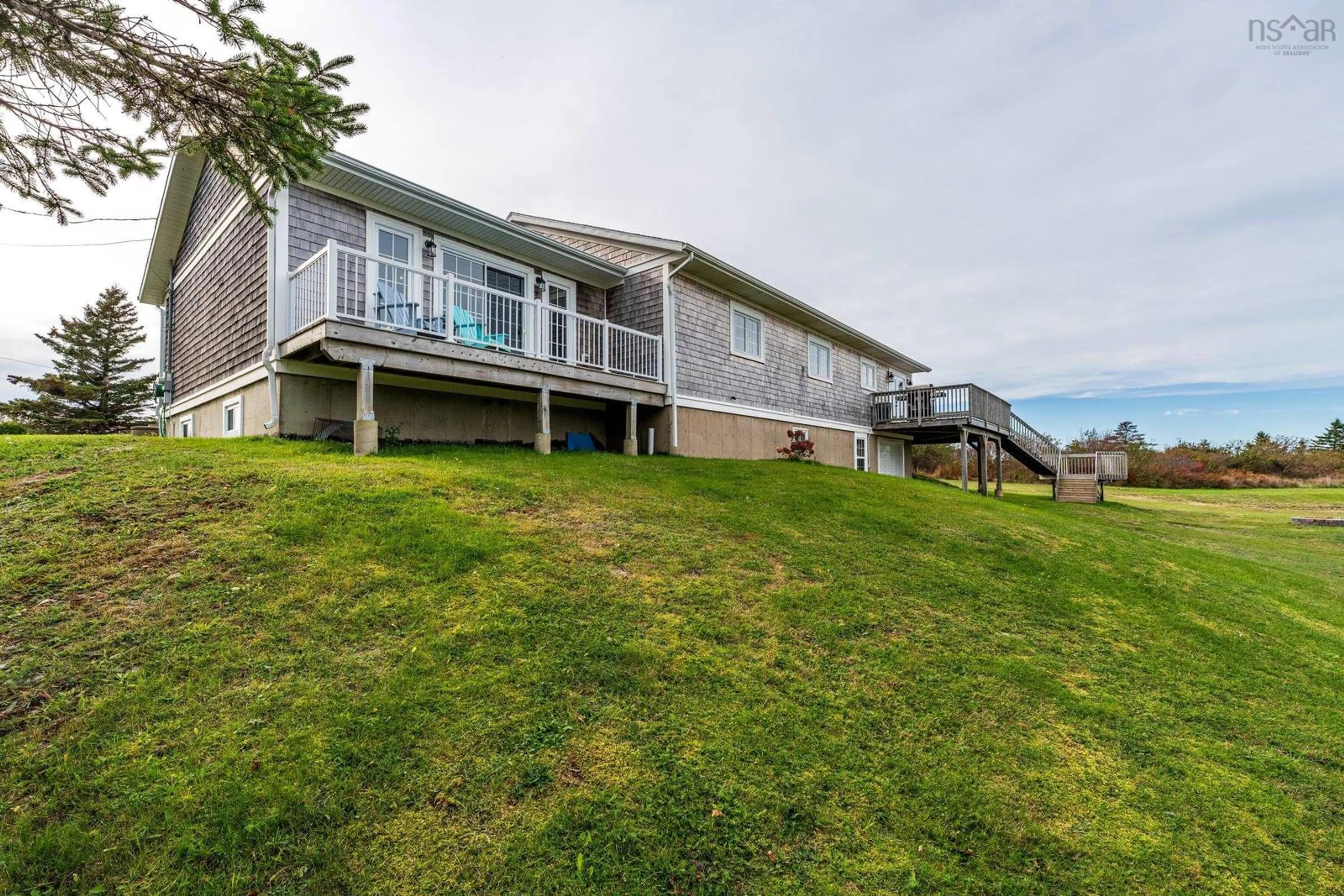 A pic from outside/outdoor area/front of a property/back of a property/a pic from drone, water/lake/river/ocean view for 63 Dixon Road, Grosses Coques Nova Scotia B0W 1M0