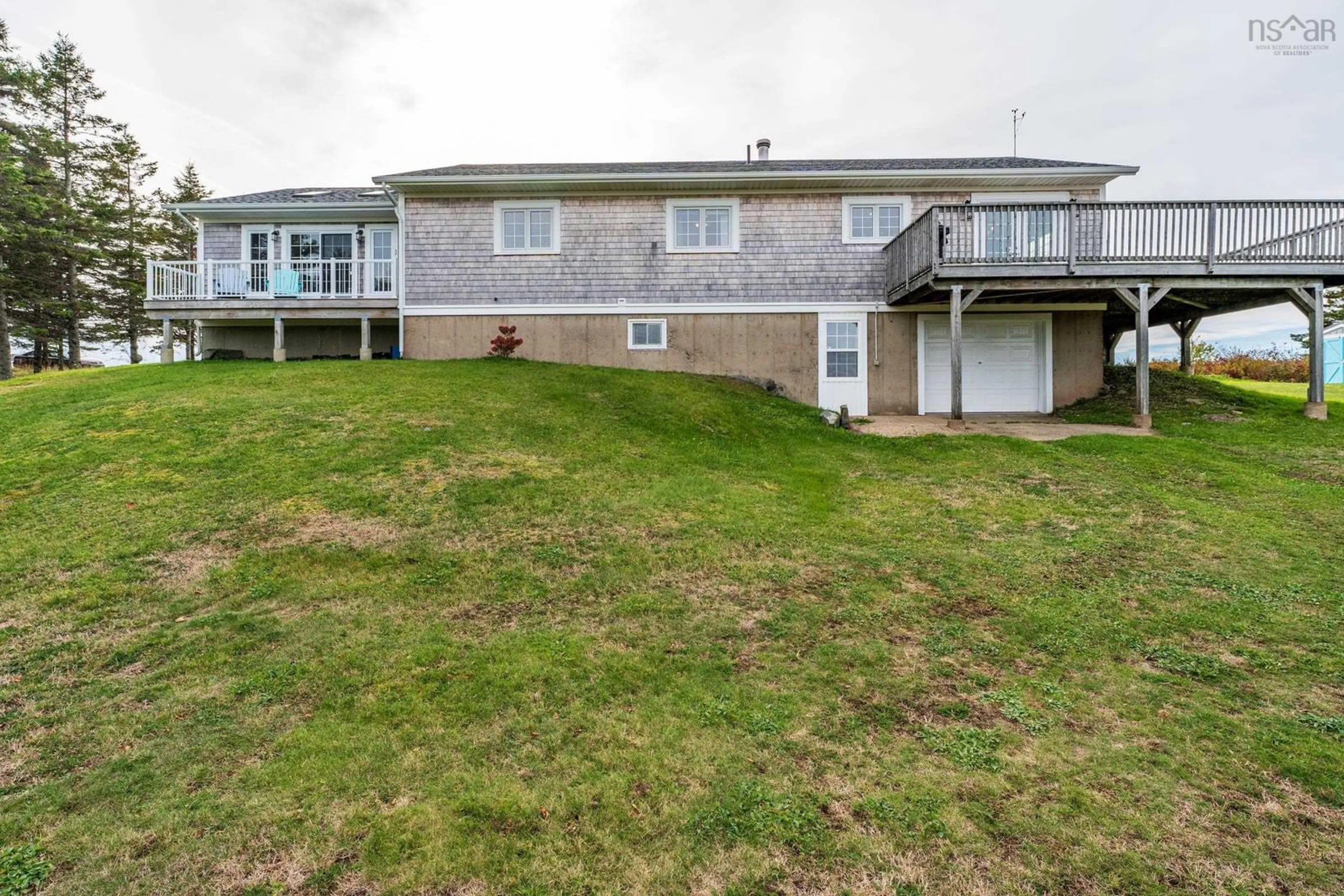 A pic from outside/outdoor area/front of a property/back of a property/a pic from drone, water/lake/river/ocean view for 63 Dixon Road, Grosses Coques Nova Scotia B0W 1M0