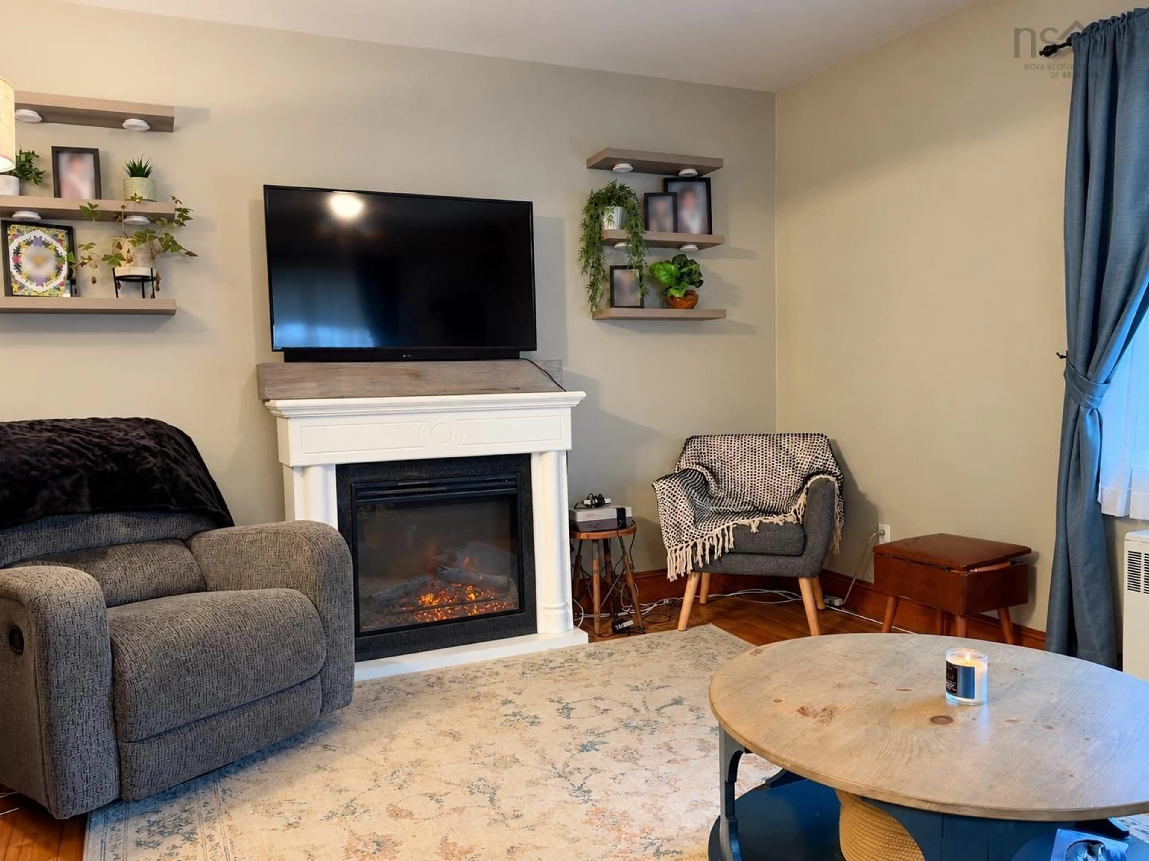 Living room with furniture, wood/laminate floor for 13 Grand St, Yarmouth Nova Scotia B5A 2Z7