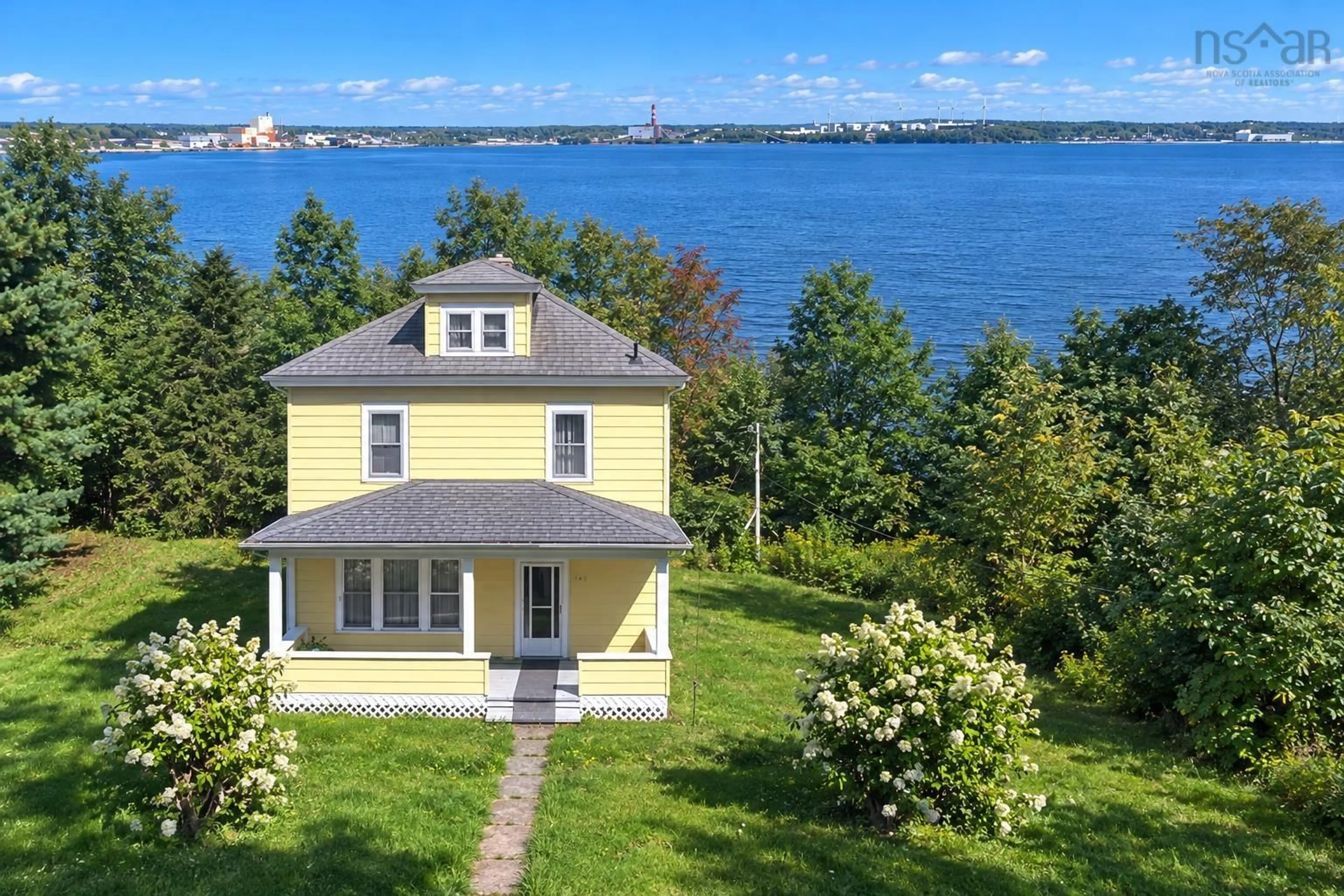 A pic from outside/outdoor area/front of a property/back of a property/a pic from drone, water/lake/river/ocean view for 650 Main St, Mulgrave Nova Scotia B0E 2G0