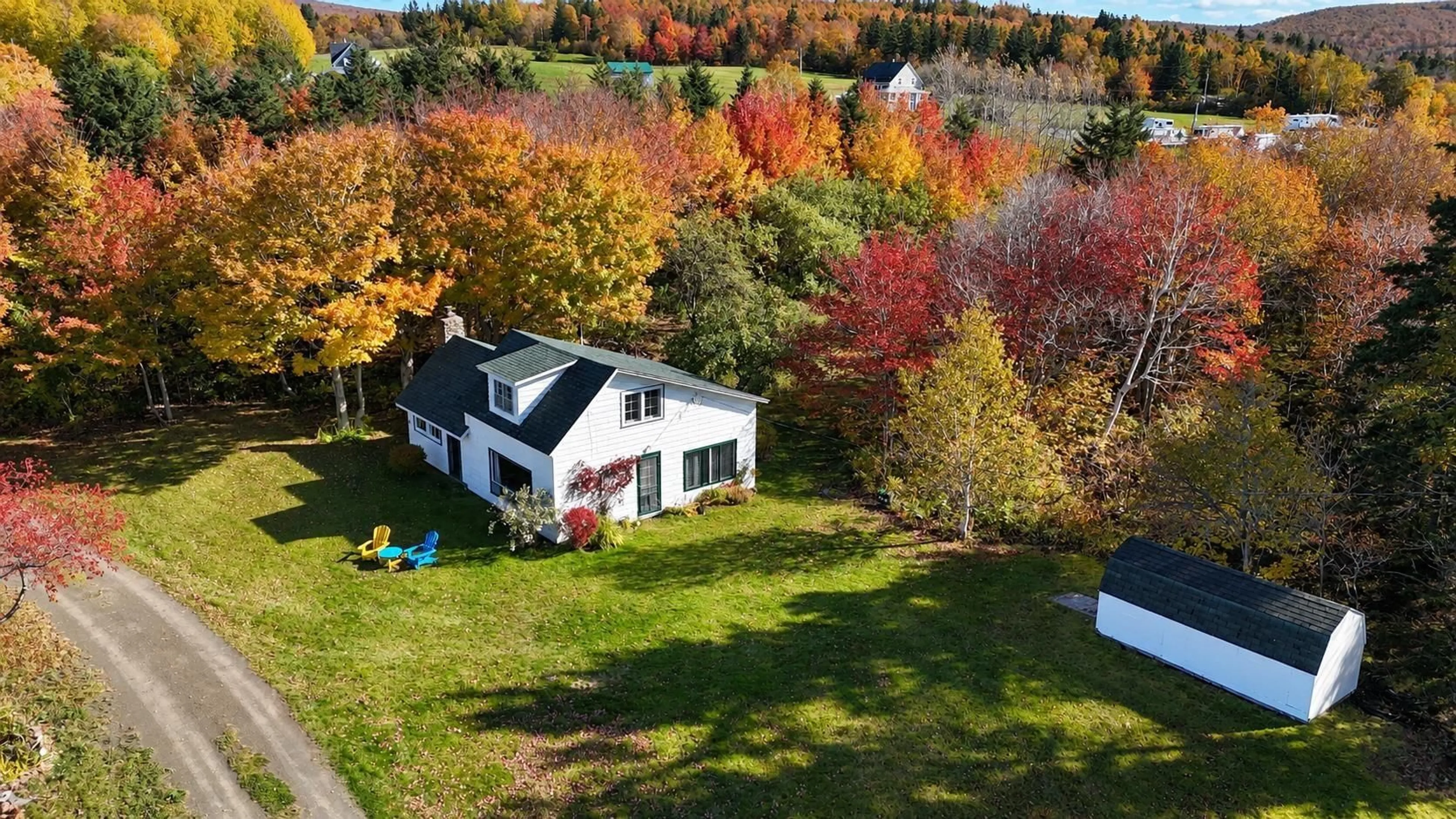 A pic from outside/outdoor area/front of a property/back of a property/a pic from drone, water/lake/river/ocean view for 2477 Highway 395, East Lake Ainslie Nova Scotia B0E 3M0