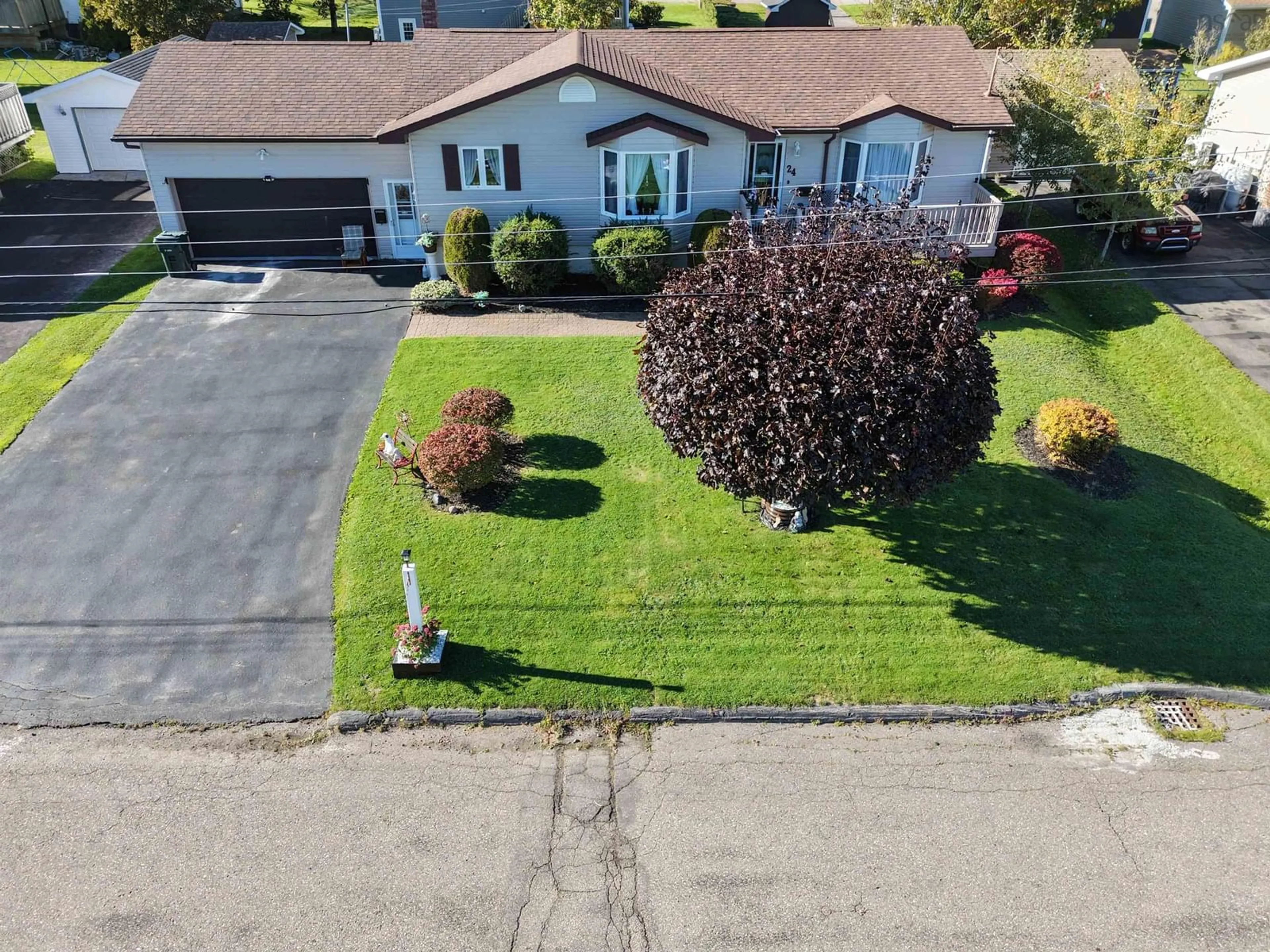 A pic from outside/outdoor area/front of a property/back of a property/a pic from drone, street for 24 Andrews Avenue, Coxheath Nova Scotia B1R 2H4