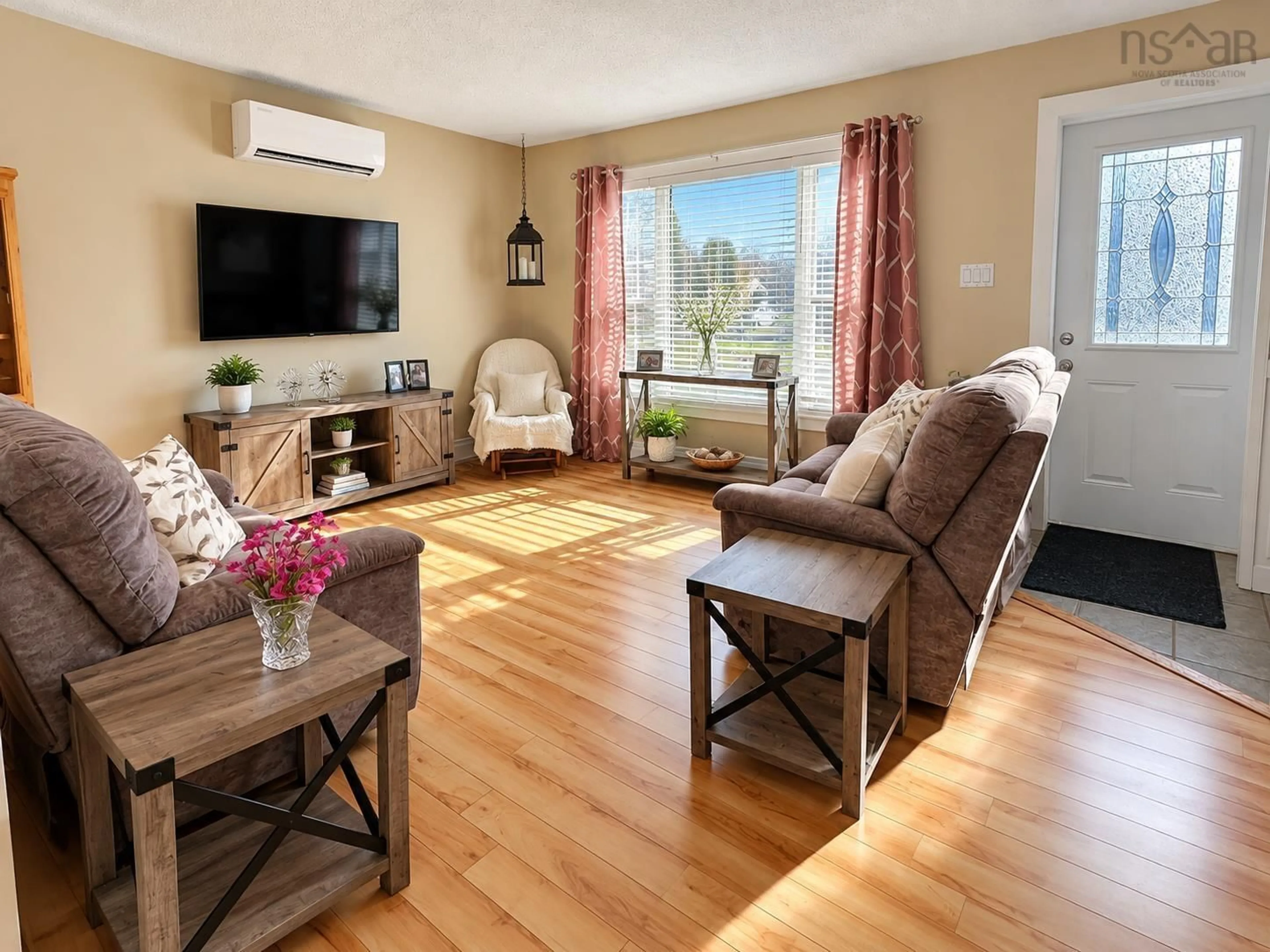 Living room with furniture, wood/laminate floor for 48 Old Port Mouton Rd, Liverpool Nova Scotia B0T 1K0