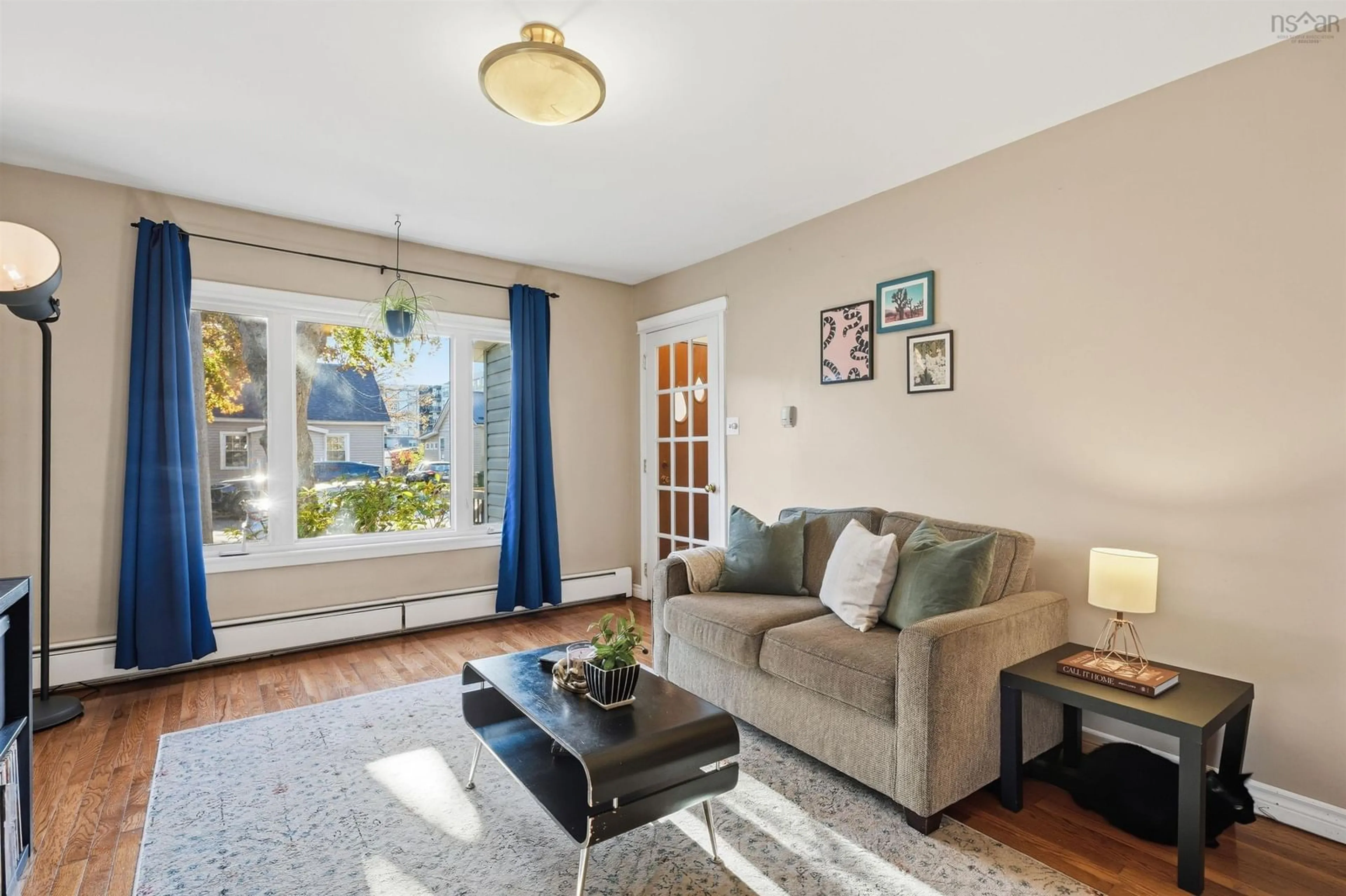 Living room with furniture, wood/laminate floor for 27 Symonds St, Dartmouth Nova Scotia B3A 3L4