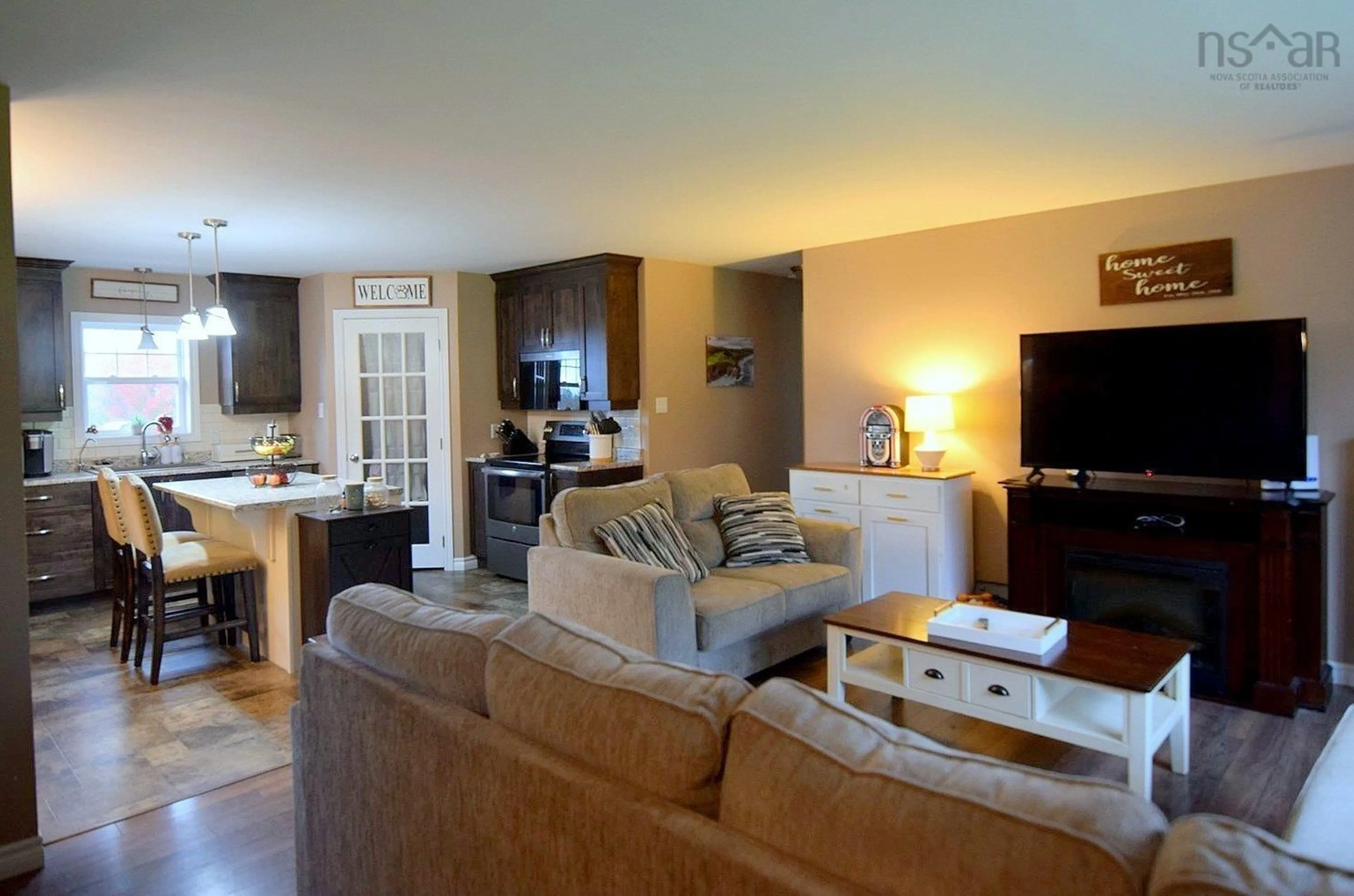 Living room with furniture, wood/laminate floor for 30 Inverside Lane, Inverness Nova Scotia B0E 1N0