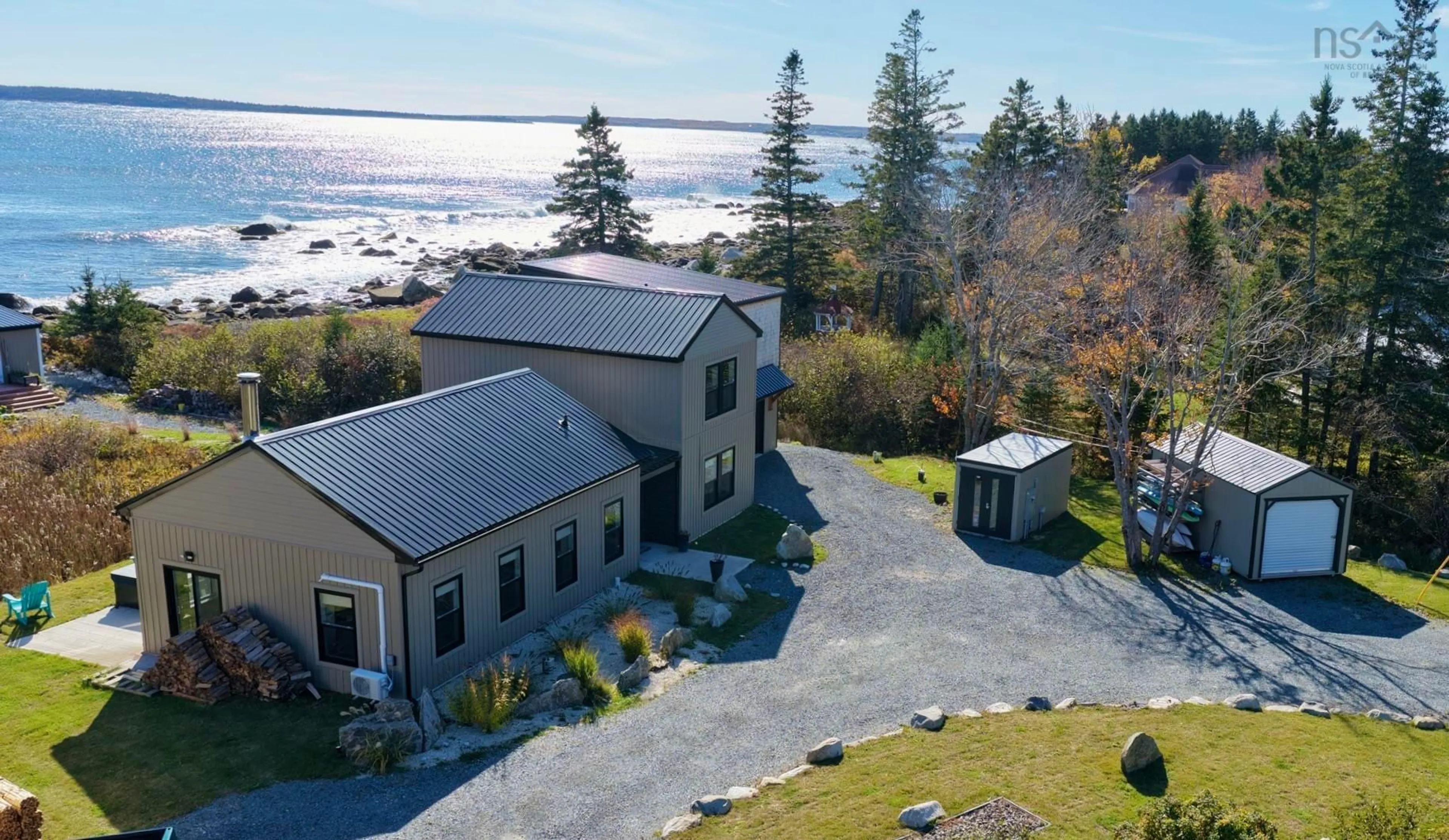 A pic from outside/outdoor area/front of a property/back of a property/a pic from drone, water/lake/river/ocean view for 6827 Highway 3, Hunt's Point Nova Scotia B0T 1G0