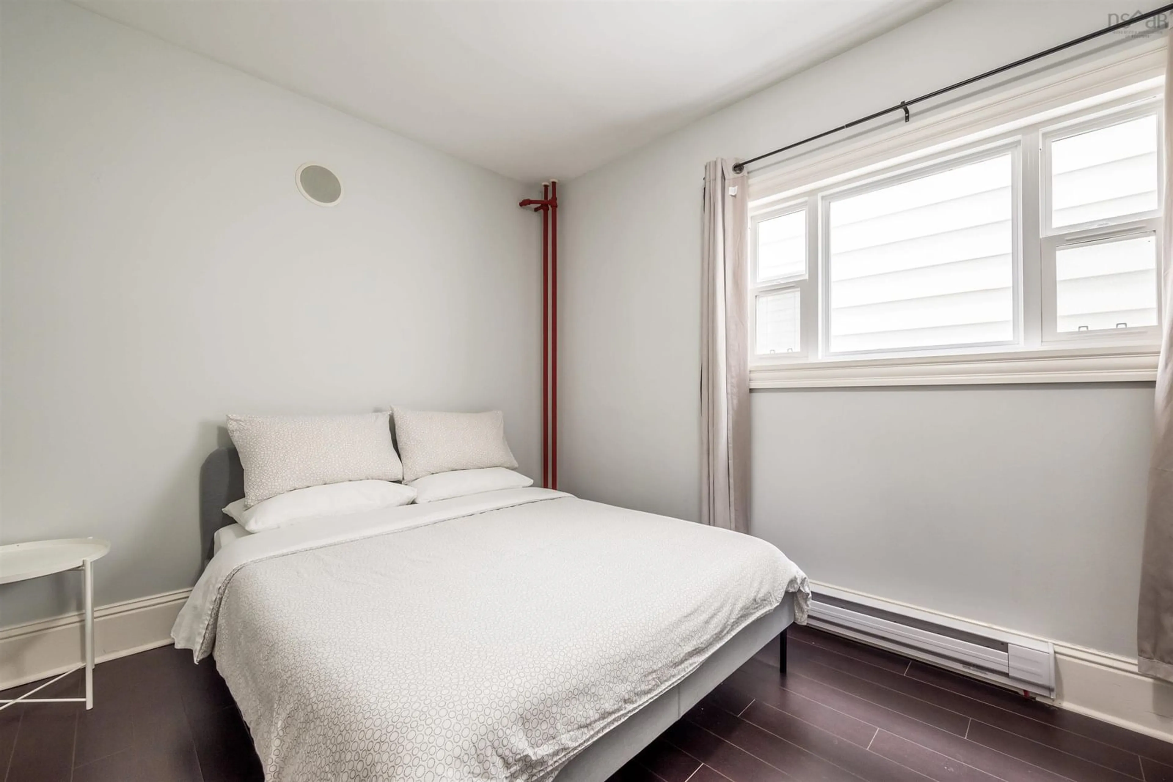 Bedroom with bed, wood/laminate floor for 6307 Chebucto Rd, Halifax Nova Scotia B3L 1K9