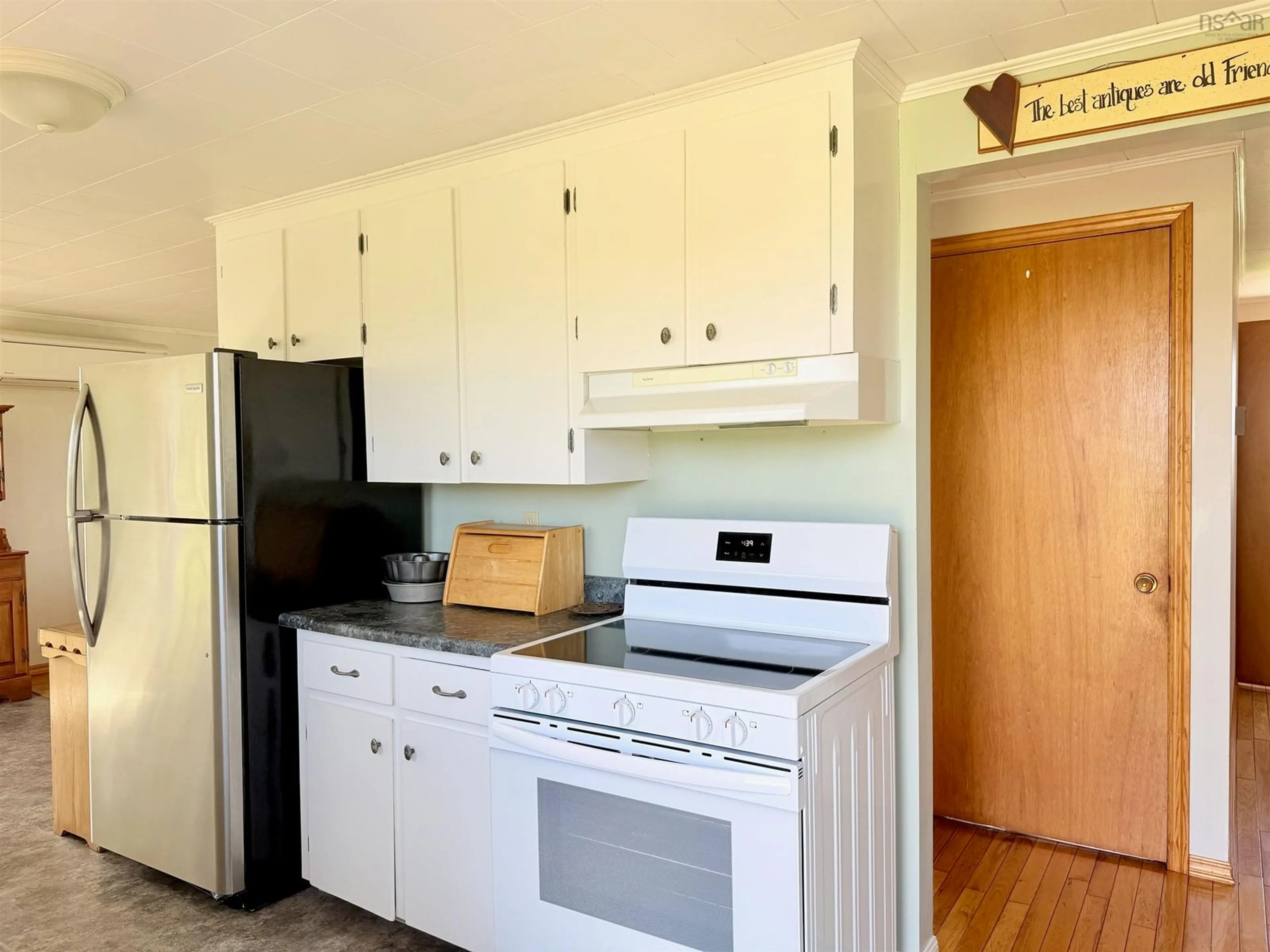 Standard kitchen, wood/laminate floor for 1798 Highway 3, East Pubnico Nova Scotia B0W 2W0