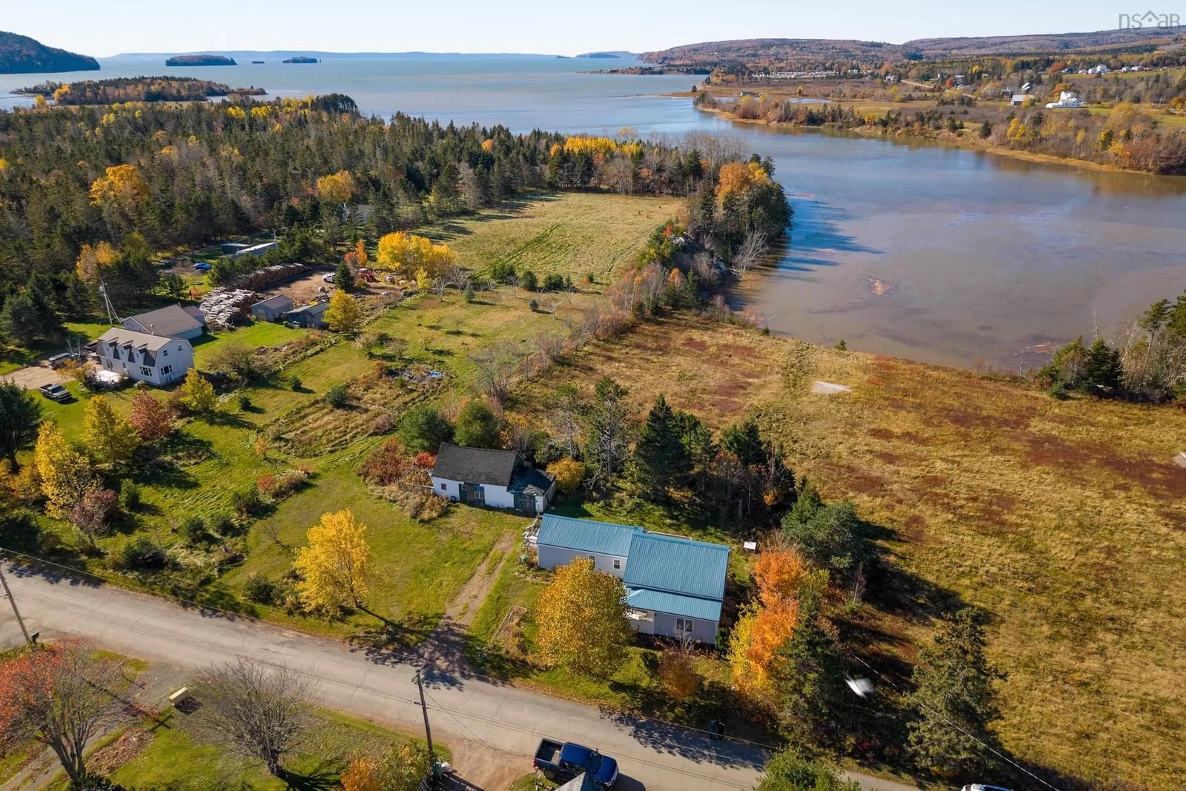 A pic from outside/outdoor area/front of a property/back of a property/a pic from drone, water/lake/river/ocean view for 70 Wharf Rd, Five Islands Nova Scotia B0M 1K0