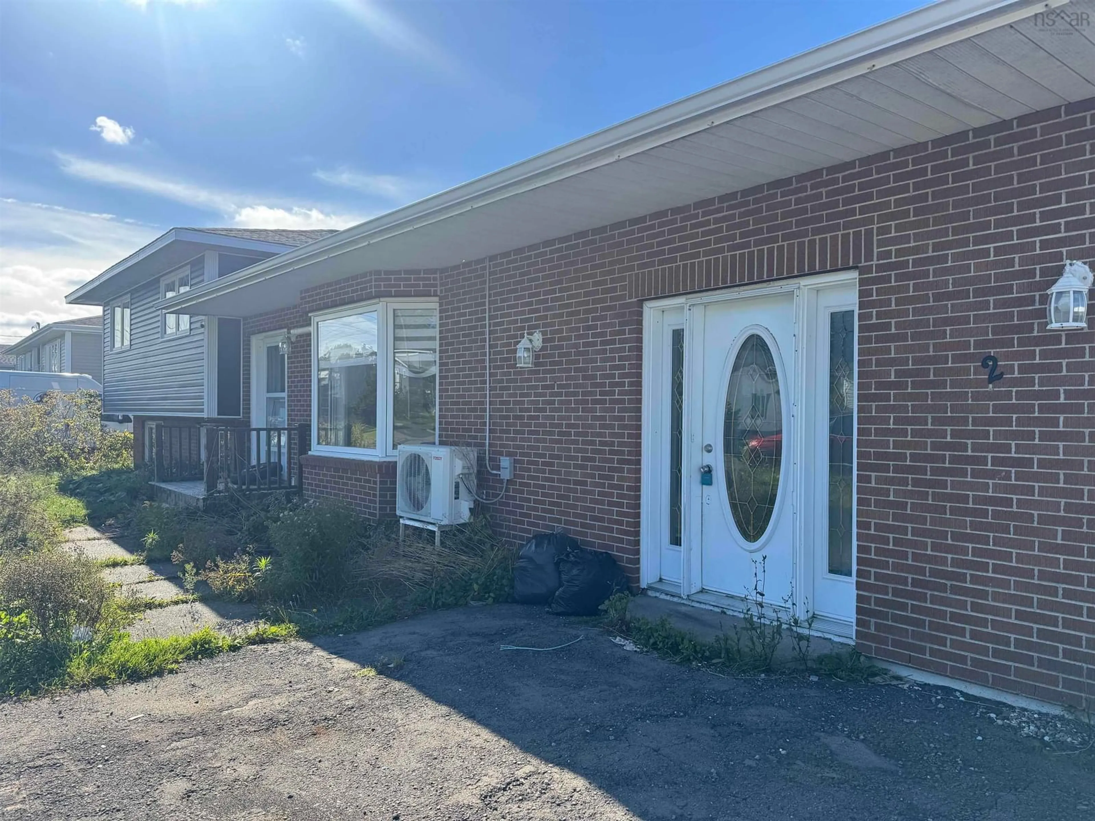 Home with brick exterior material, street for 2 Cherry St St, Sydney Mines Nova Scotia B1V 3C2