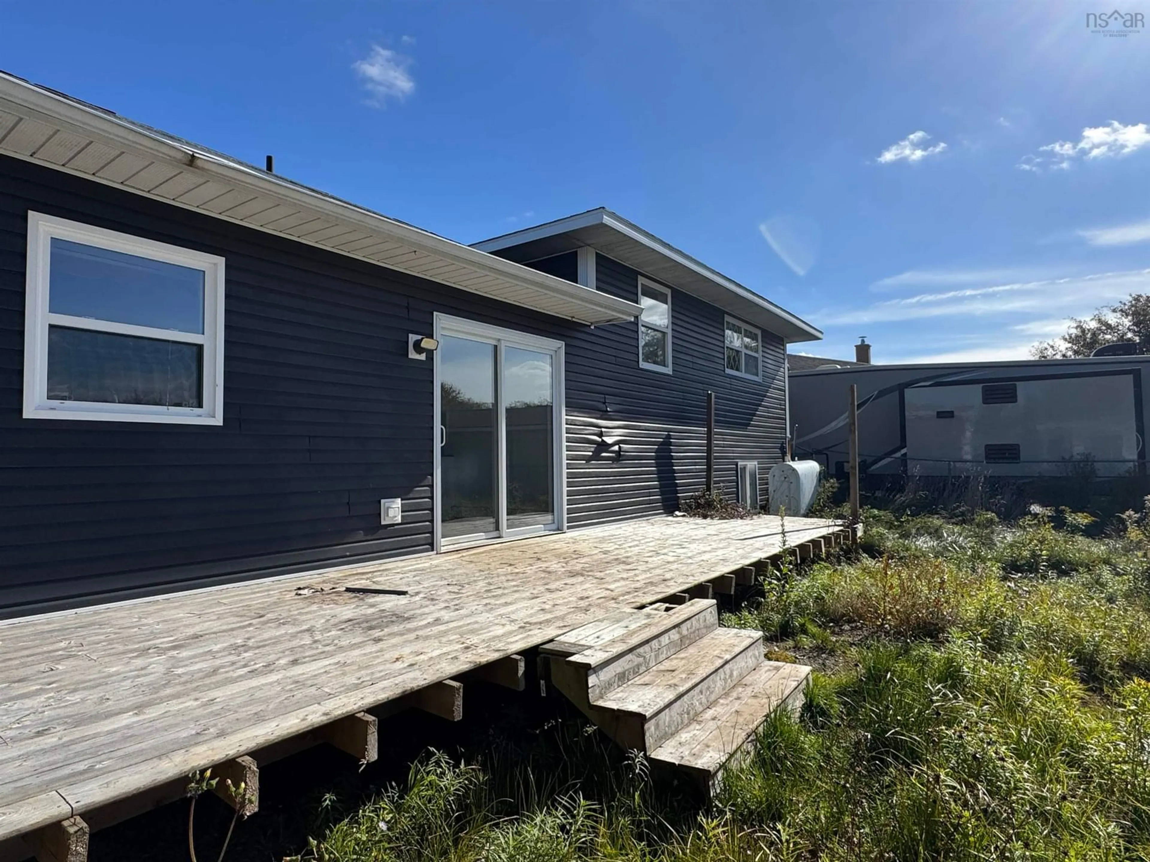 A pic from outside/outdoor area/front of a property/back of a property/a pic from drone, water/lake/river/ocean view for 2 Cherry St St, Sydney Mines Nova Scotia B1V 3C2