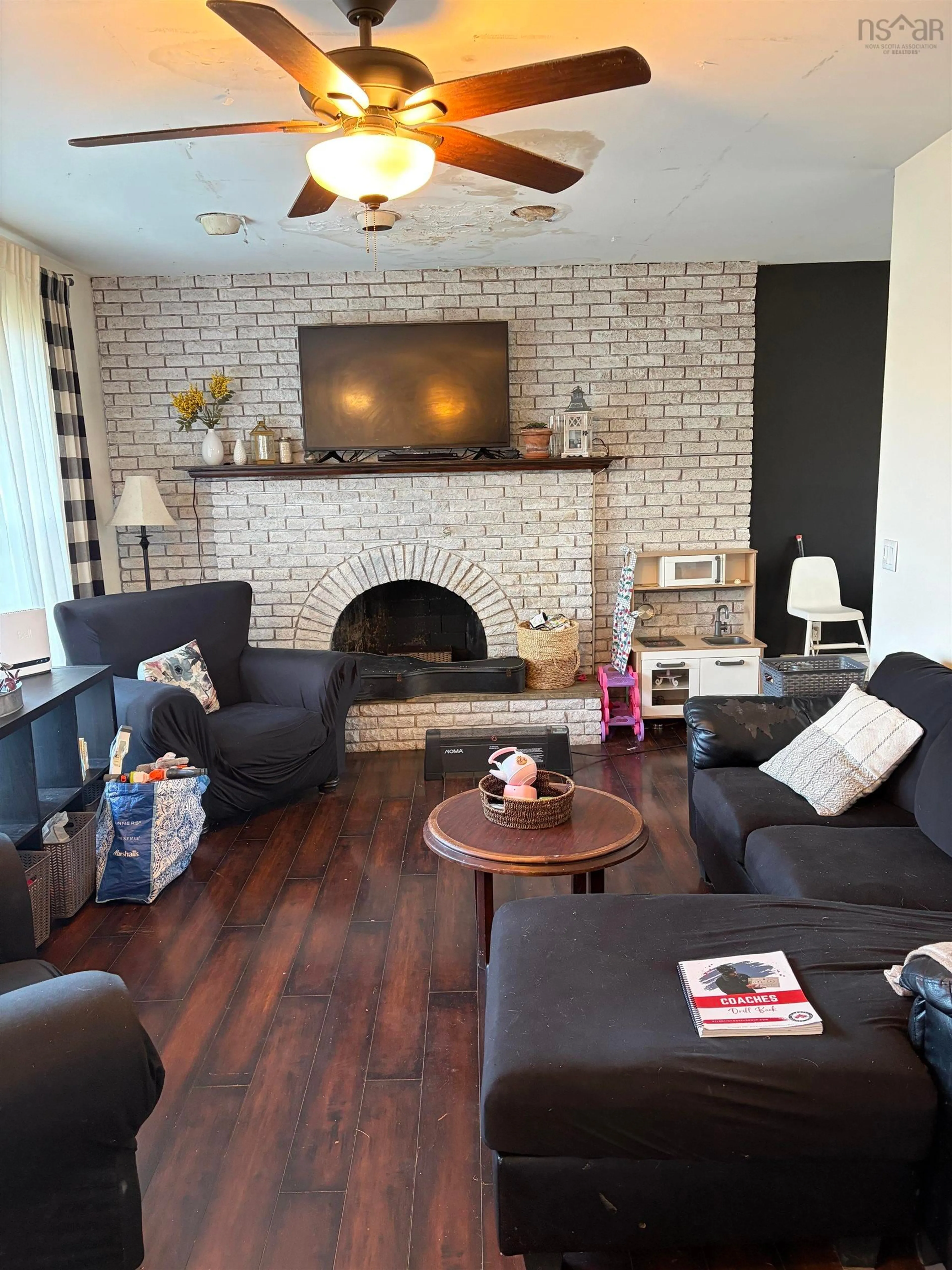Living room with furniture, wood/laminate floor for 9 Turner St, Glace Bay Nova Scotia B1A 5W5