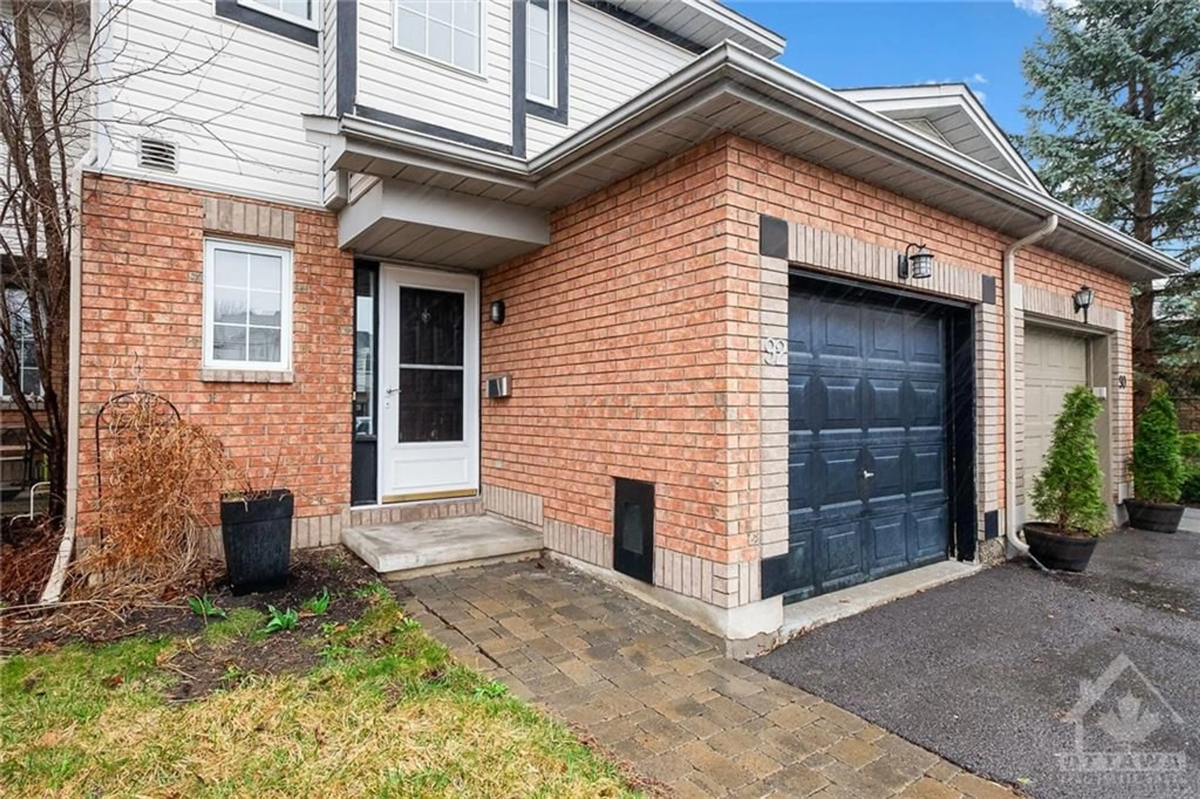 Home with brick exterior material for 92 COLLEGE Cir, Ottawa Ontario K1K 4R8