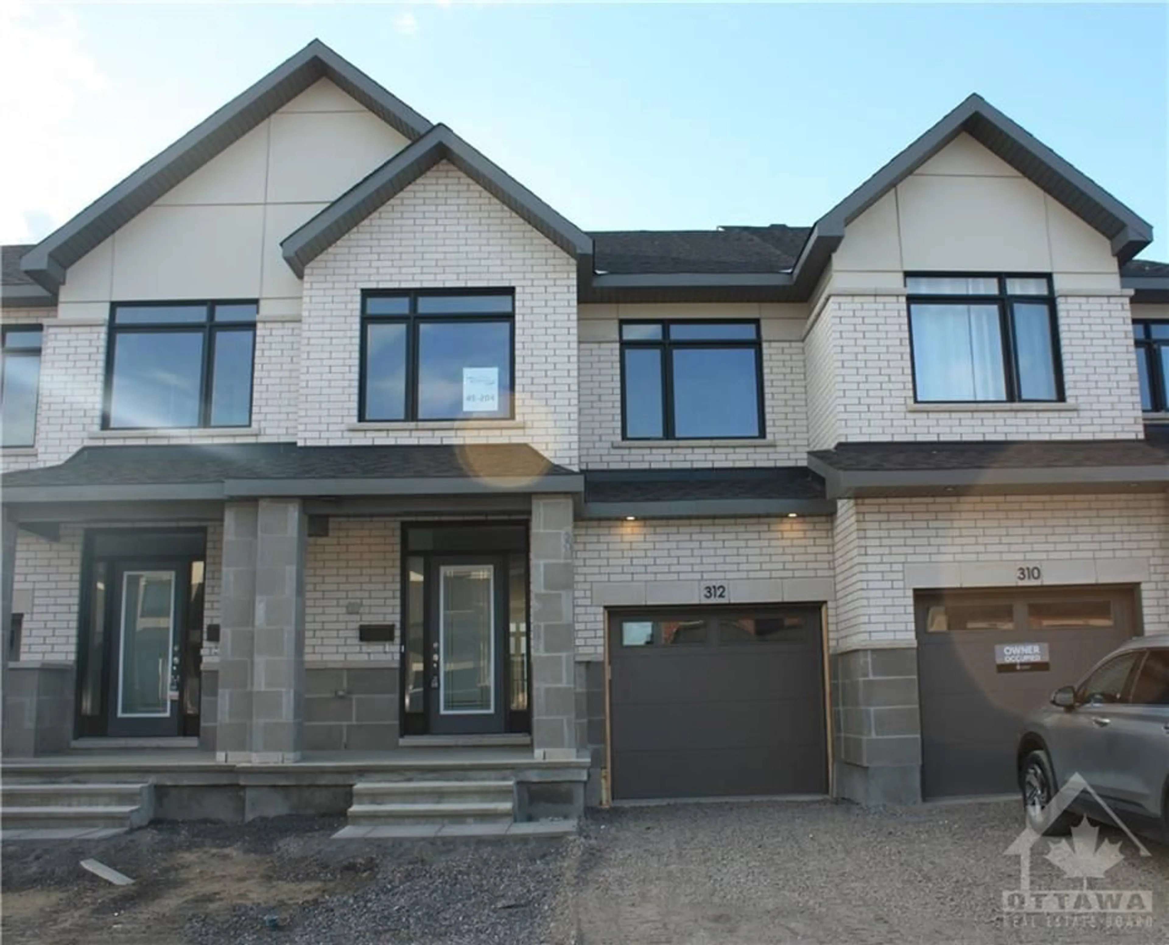 Home with brick exterior material for 312 MAKOBE Lane, Ottawa Ontario K4M 0M1