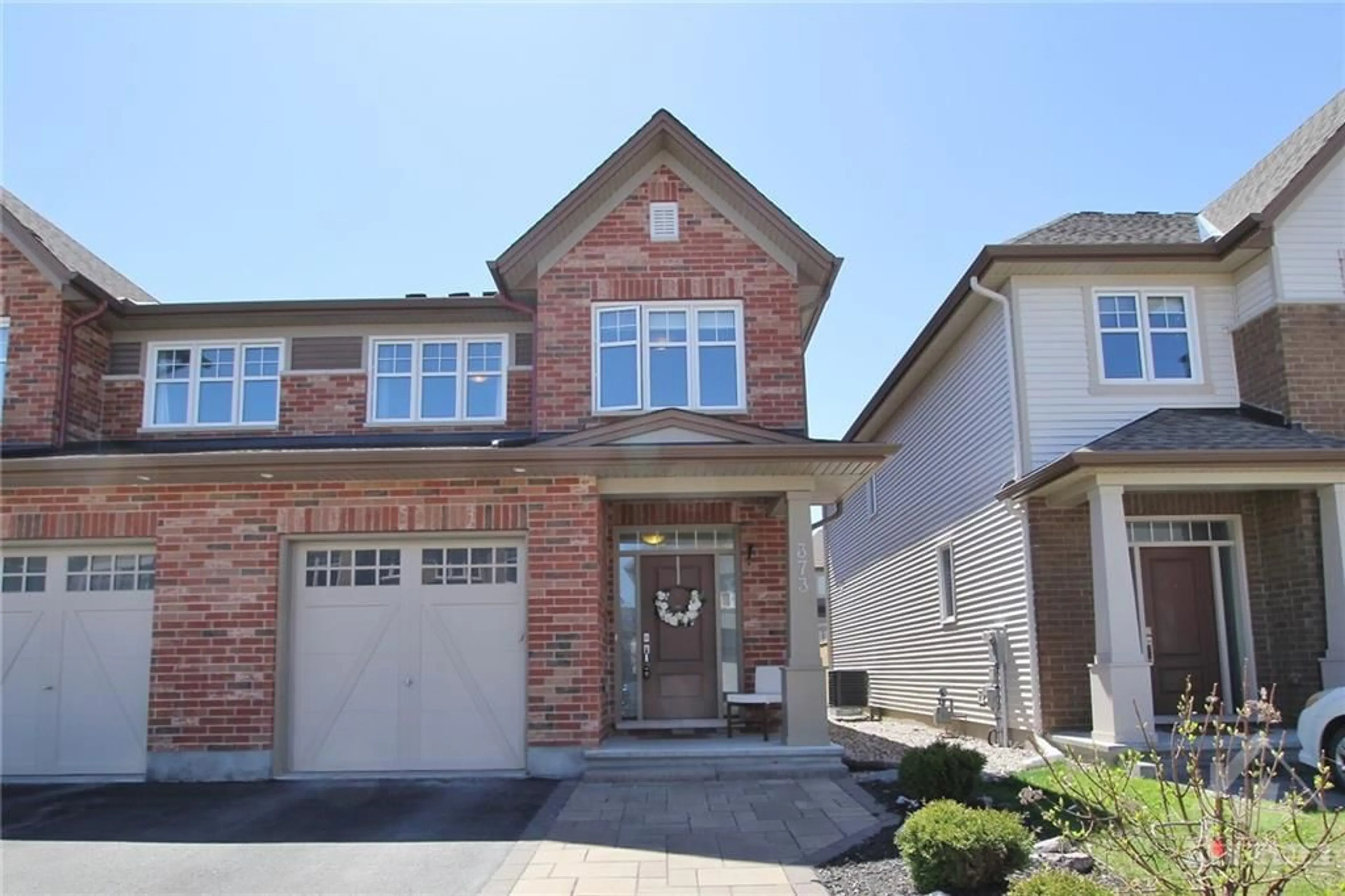 Home with brick exterior material for 373 WARMSTONE Dr, Ottawa Ontario K2S 0W5