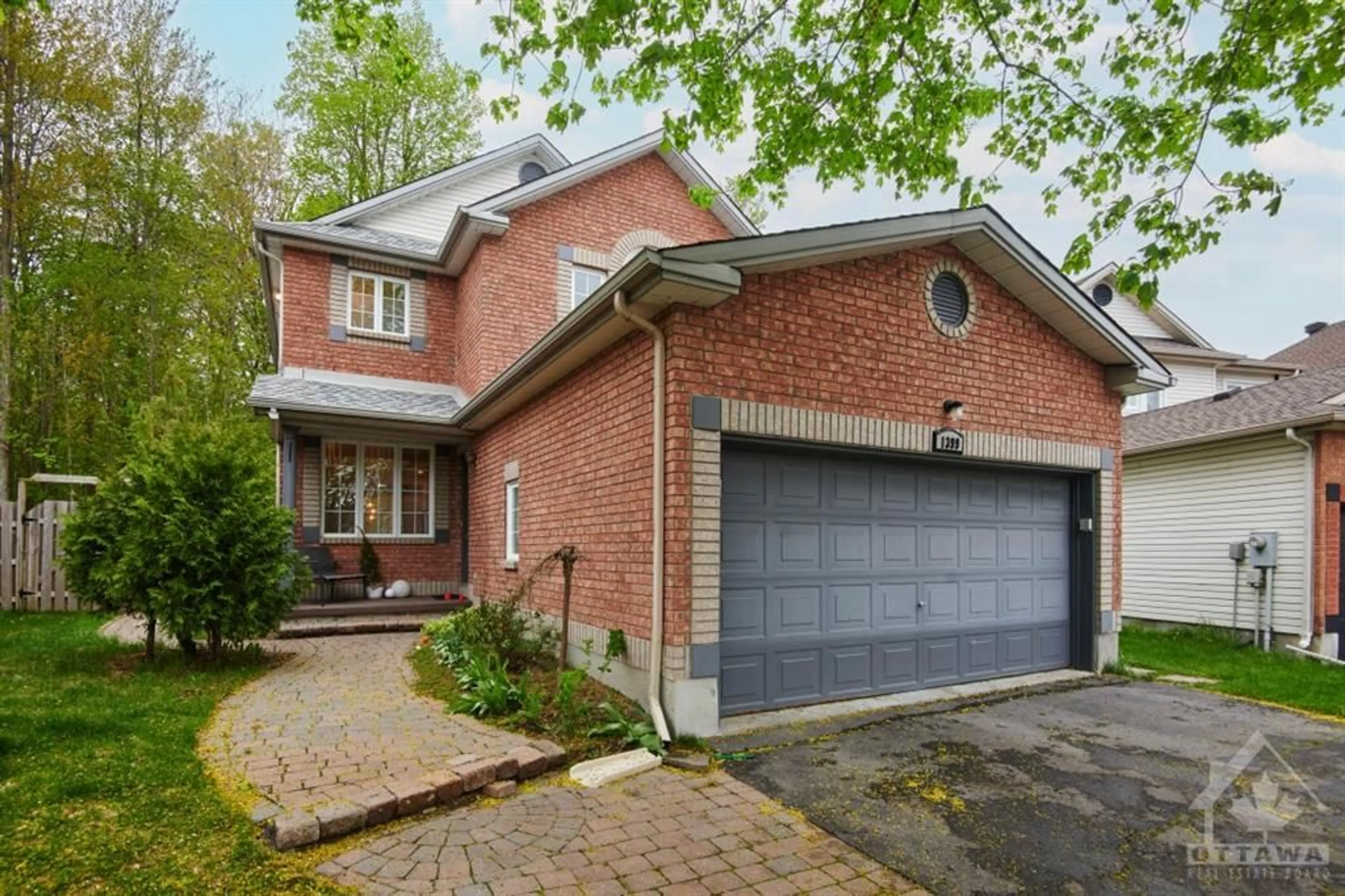 Home with brick exterior material for 1399 TREATY Crt, Ottawa Ontario K1J 1E7