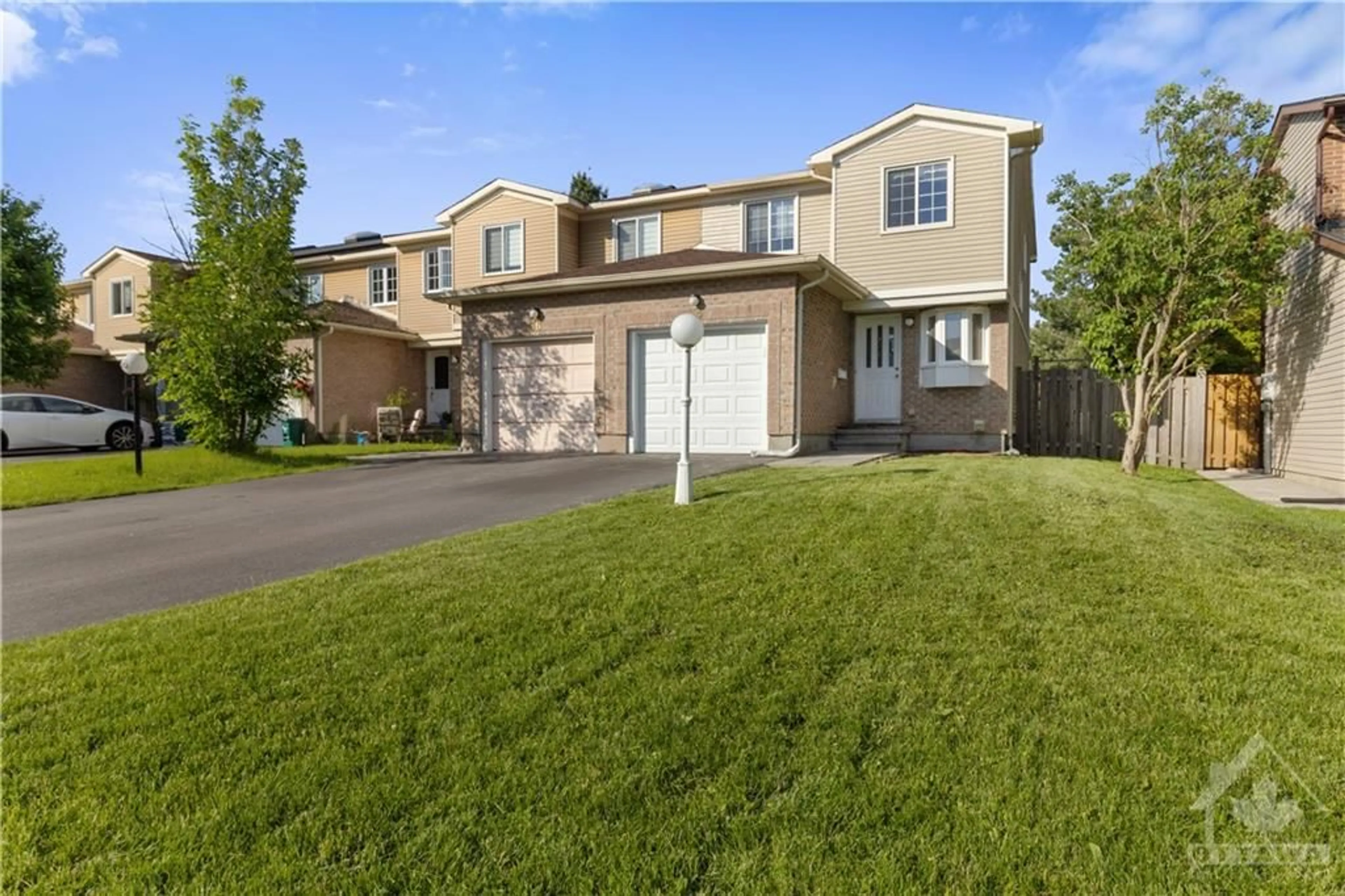 Frontside or backside of a home, the fenced backyard for 34 SHADETREE Cres, Ottawa Ontario K2E 7R2