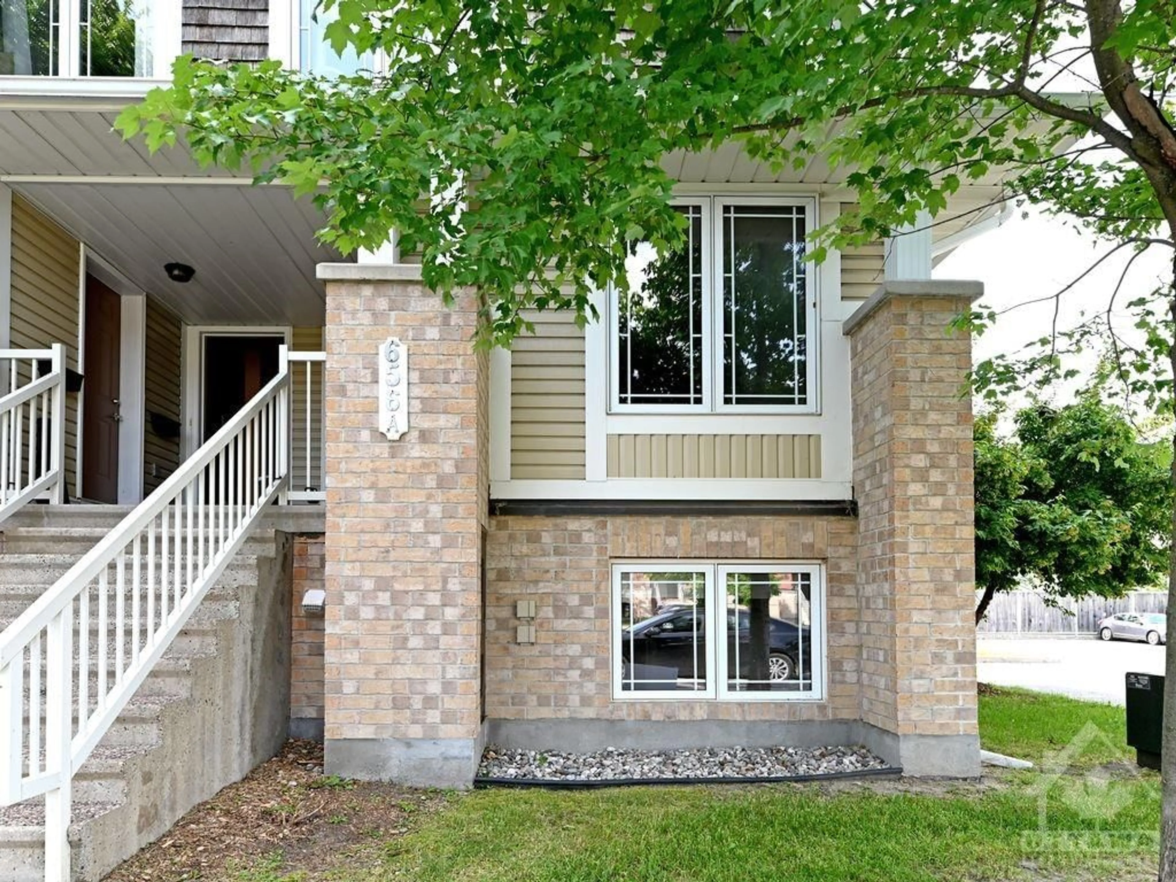 Home with brick exterior material for 656 CHAPMAN MILLS Dr #A, Ottawa Ontario K2J 3V2