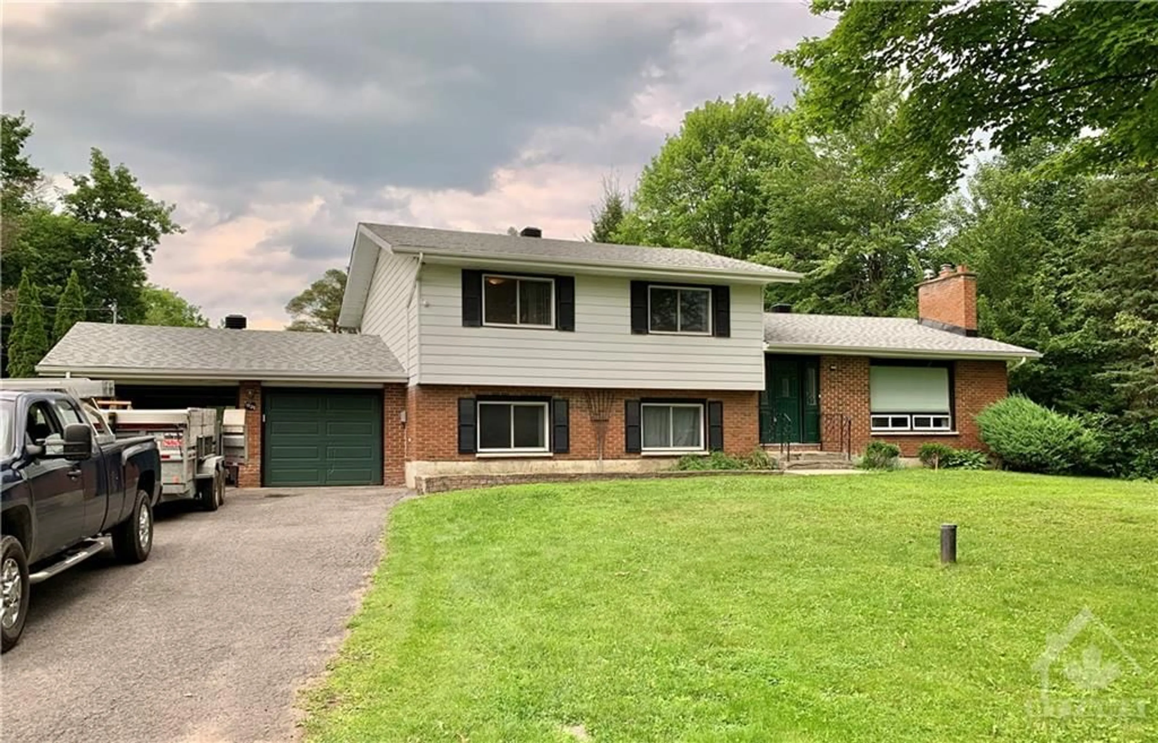 Frontside or backside of a home for 1031 MANOTICK STATION Rd, Manotick Ontario K4M 1B2