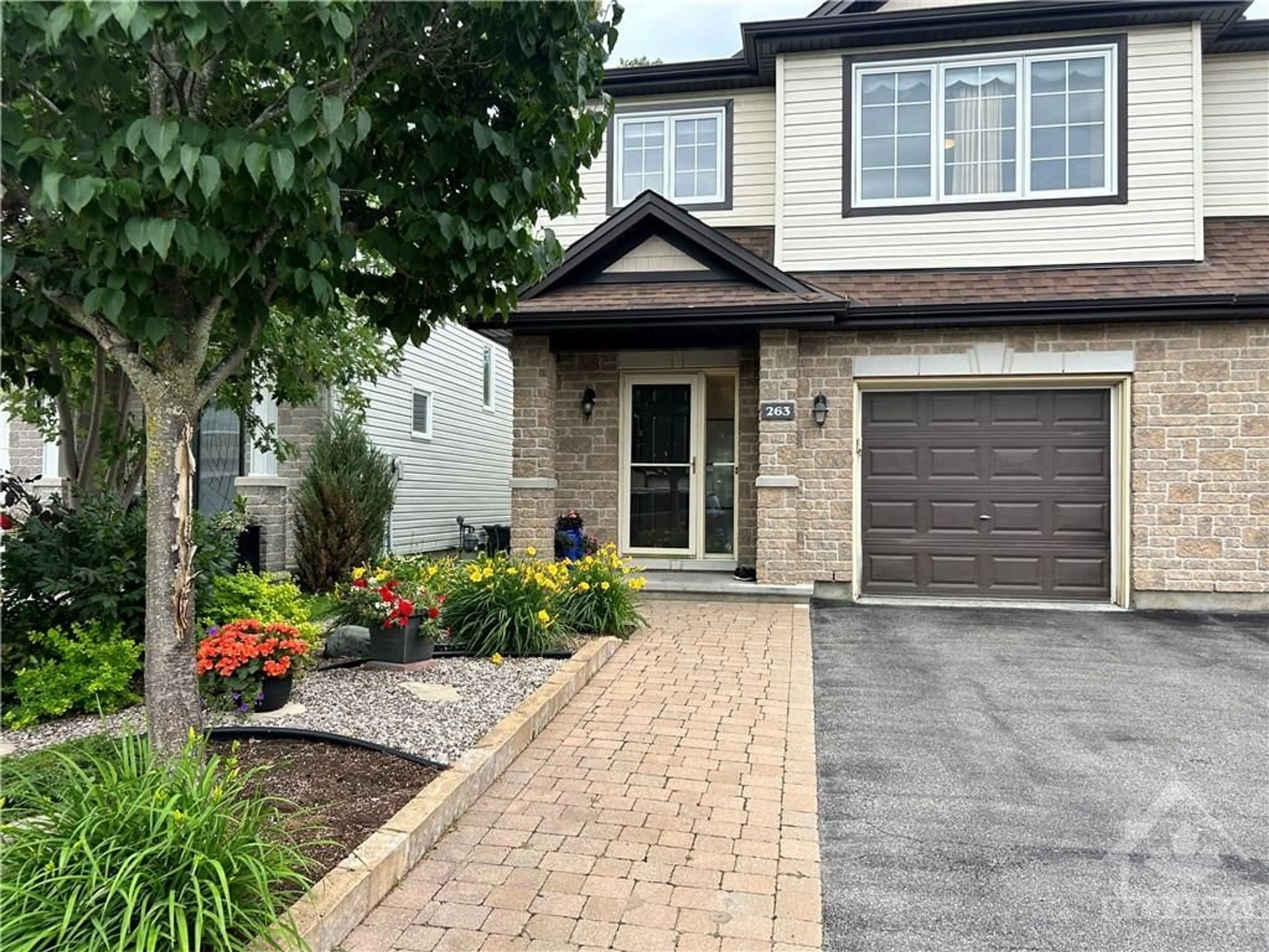 Home with brick exterior material for 263 TEWSLEY Dr, Ottawa Ontario K1V 0Y6