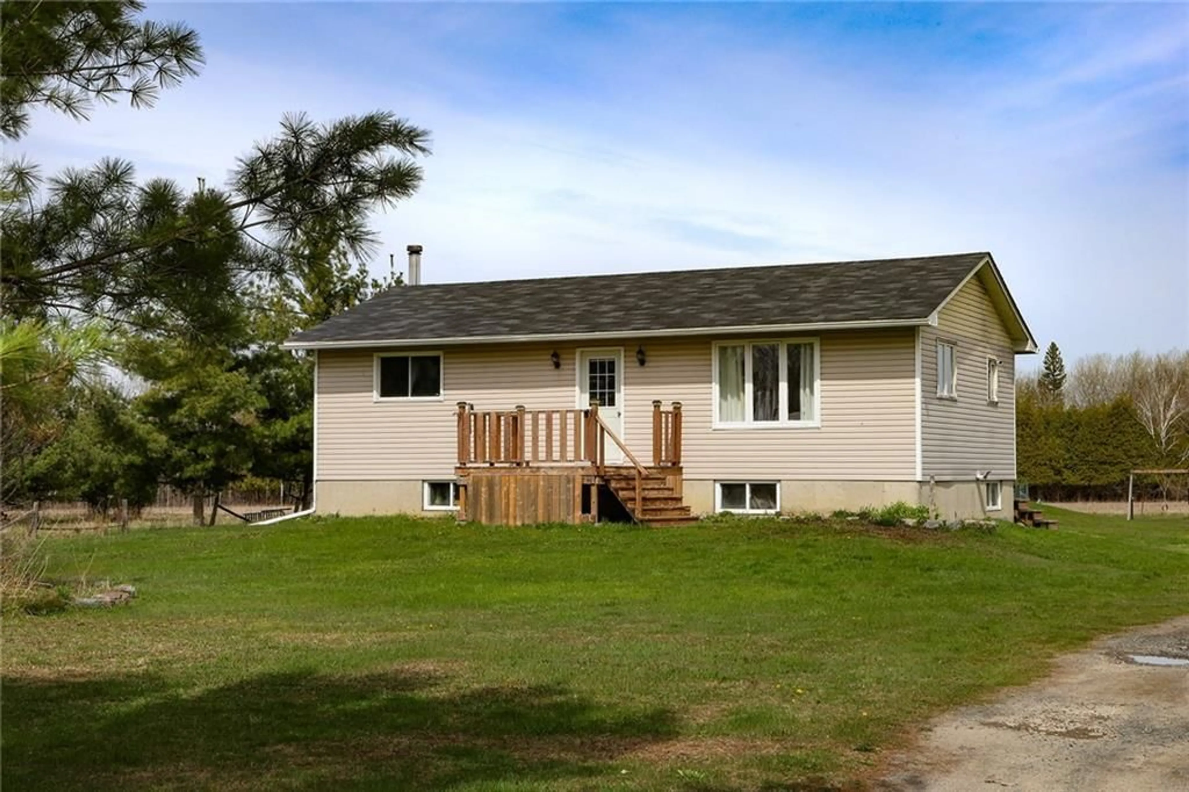 Frontside or backside of a home, the fenced backyard for 13325 COUNTY ROAD 18 Rd, Williamsburg Ontario K0C 2H0