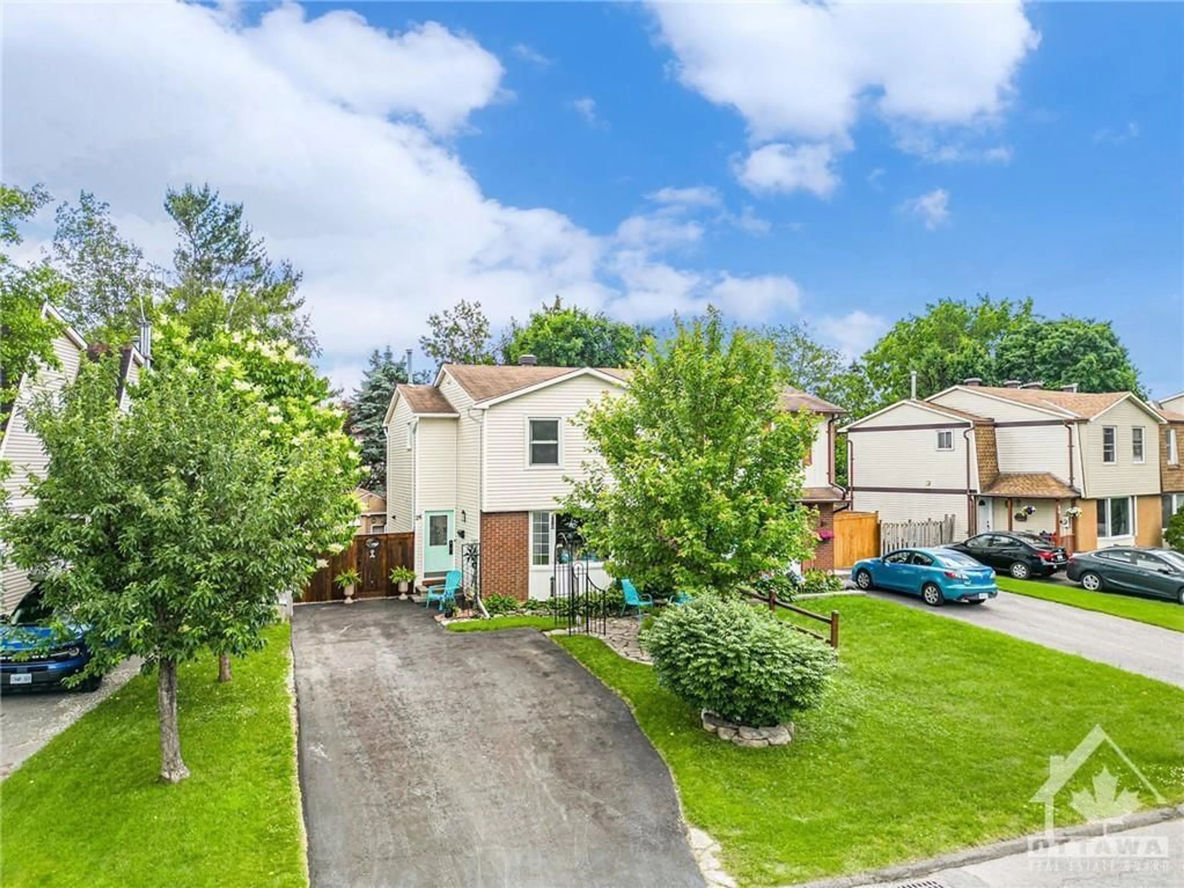 Frontside or backside of a home, the fenced backyard for 26 MELANIE Cres, Ottawa Ontario K2L 2E5