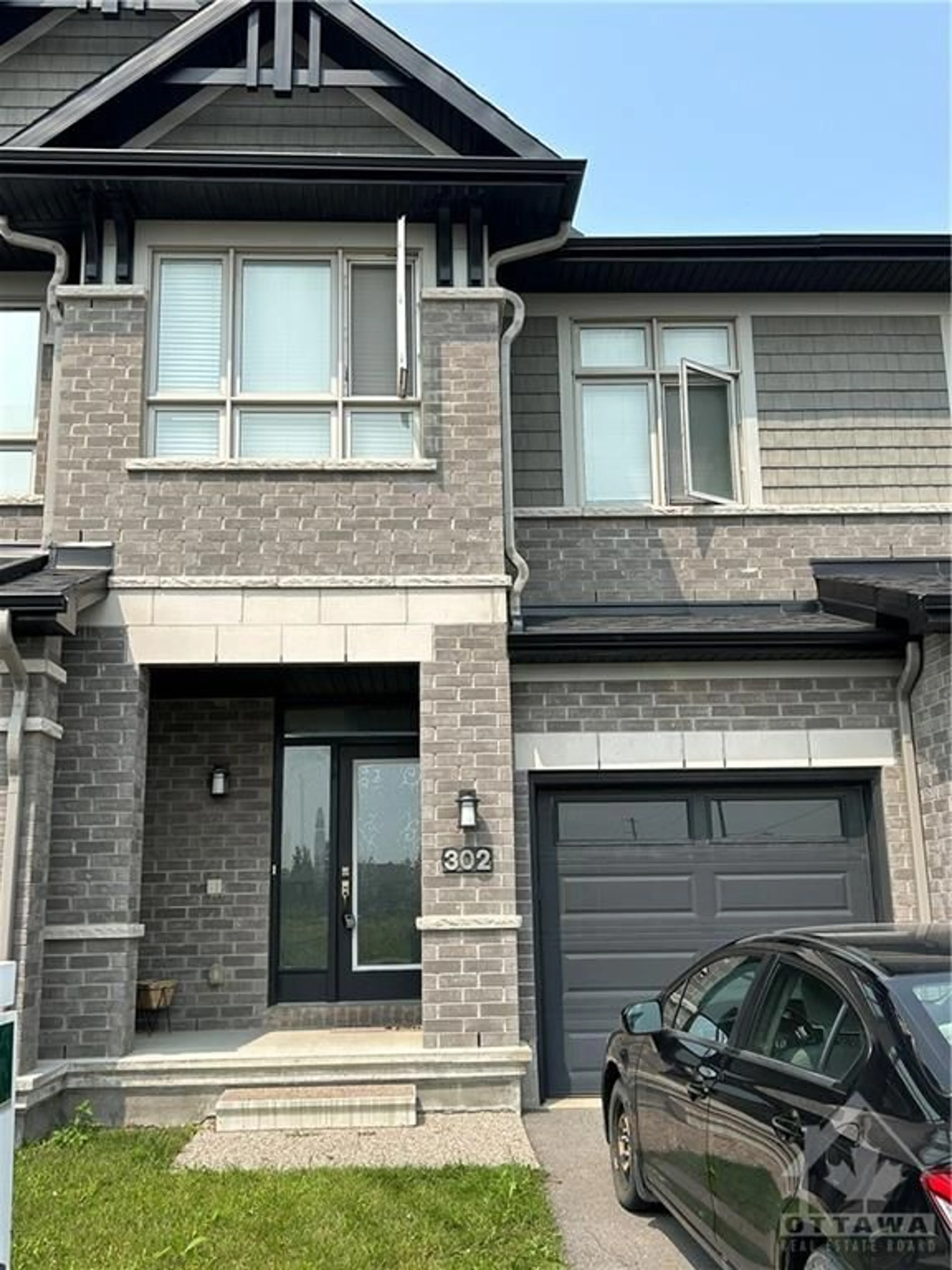 Home with brick exterior material for 302 AXIS Way, Ottawa Ontario K1W 0J9