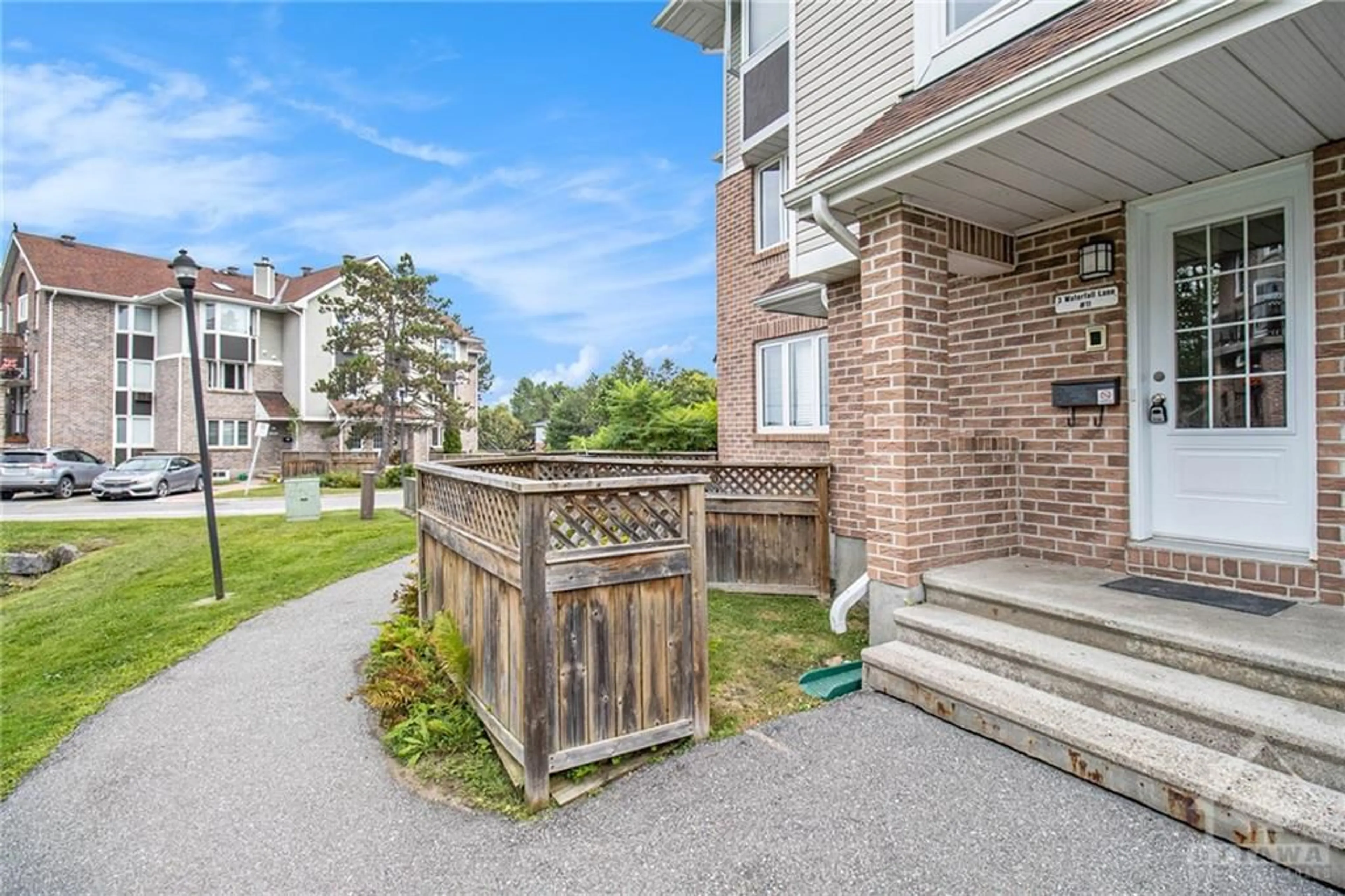 A pic from exterior of the house or condo, the fenced backyard for 3 WATERFALL Lane #11, Ottawa Ontario K2H 9N1