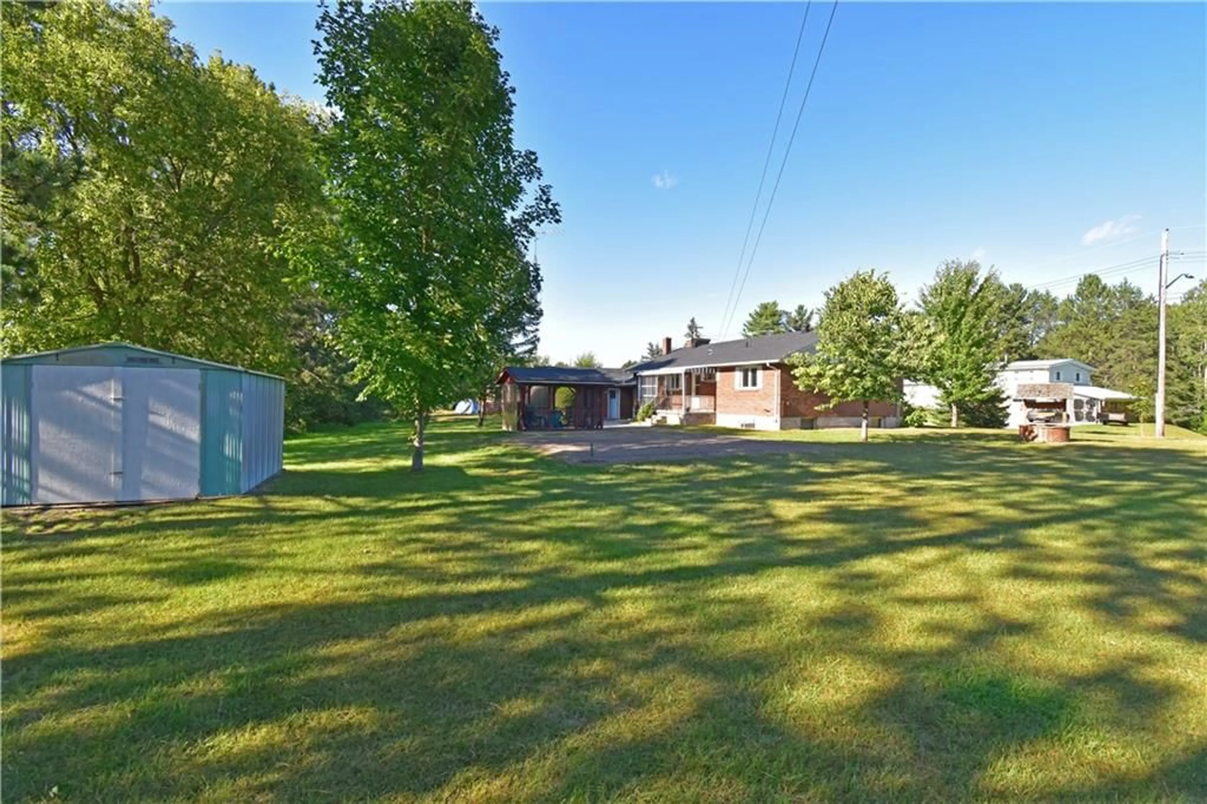 Frontside or backside of a home, the fenced backyard for 47 HENRY St, Killaloe Ontario K0J 2A0