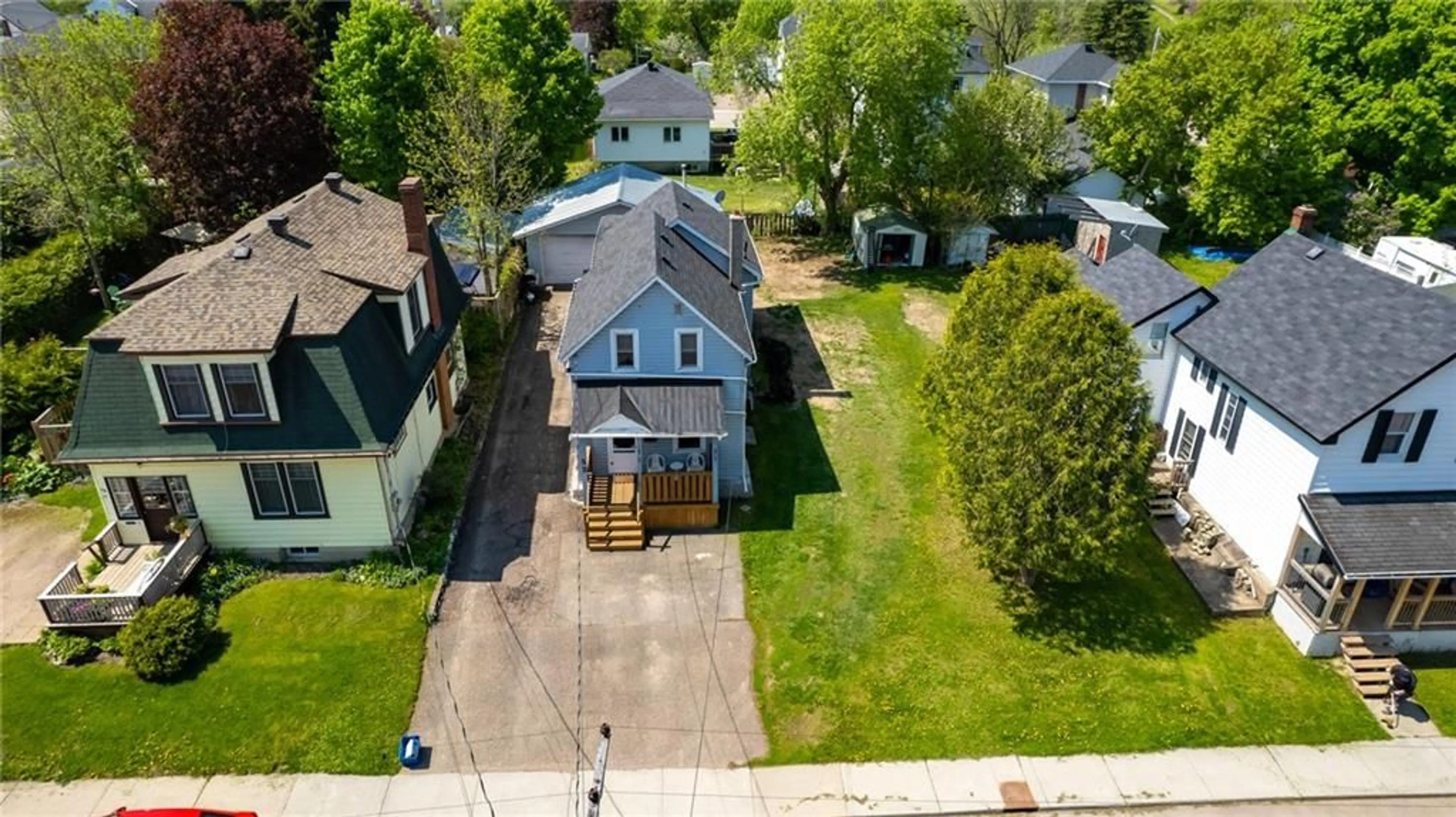 Frontside or backside of a home, the fenced backyard for 52 QUEEN St, Renfrew Ontario K7V 2A6