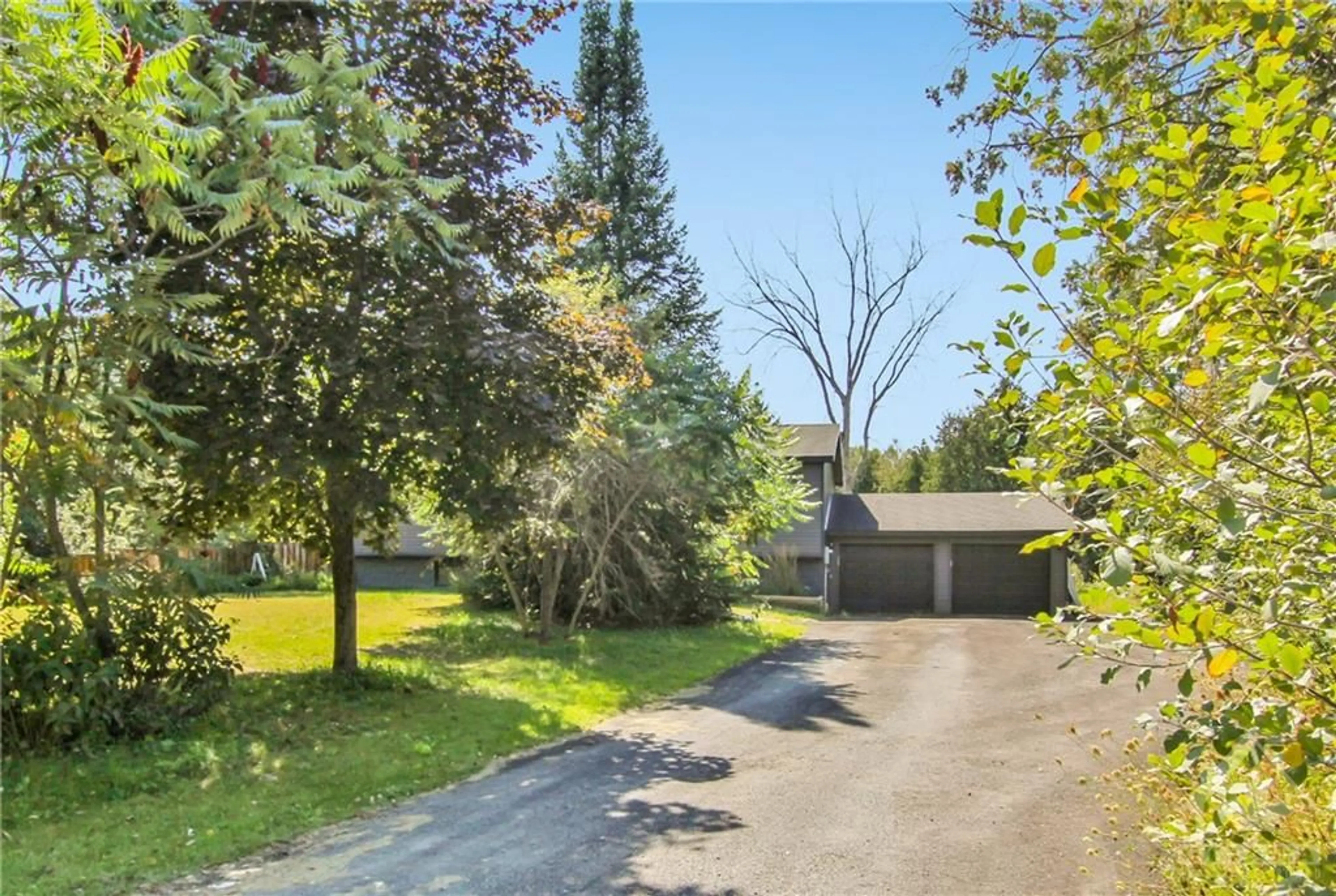 A pic from exterior of the house or condo, the fenced backyard for 2466 ASHTON STATION Rd, Ashton Ontario K0A 1B0