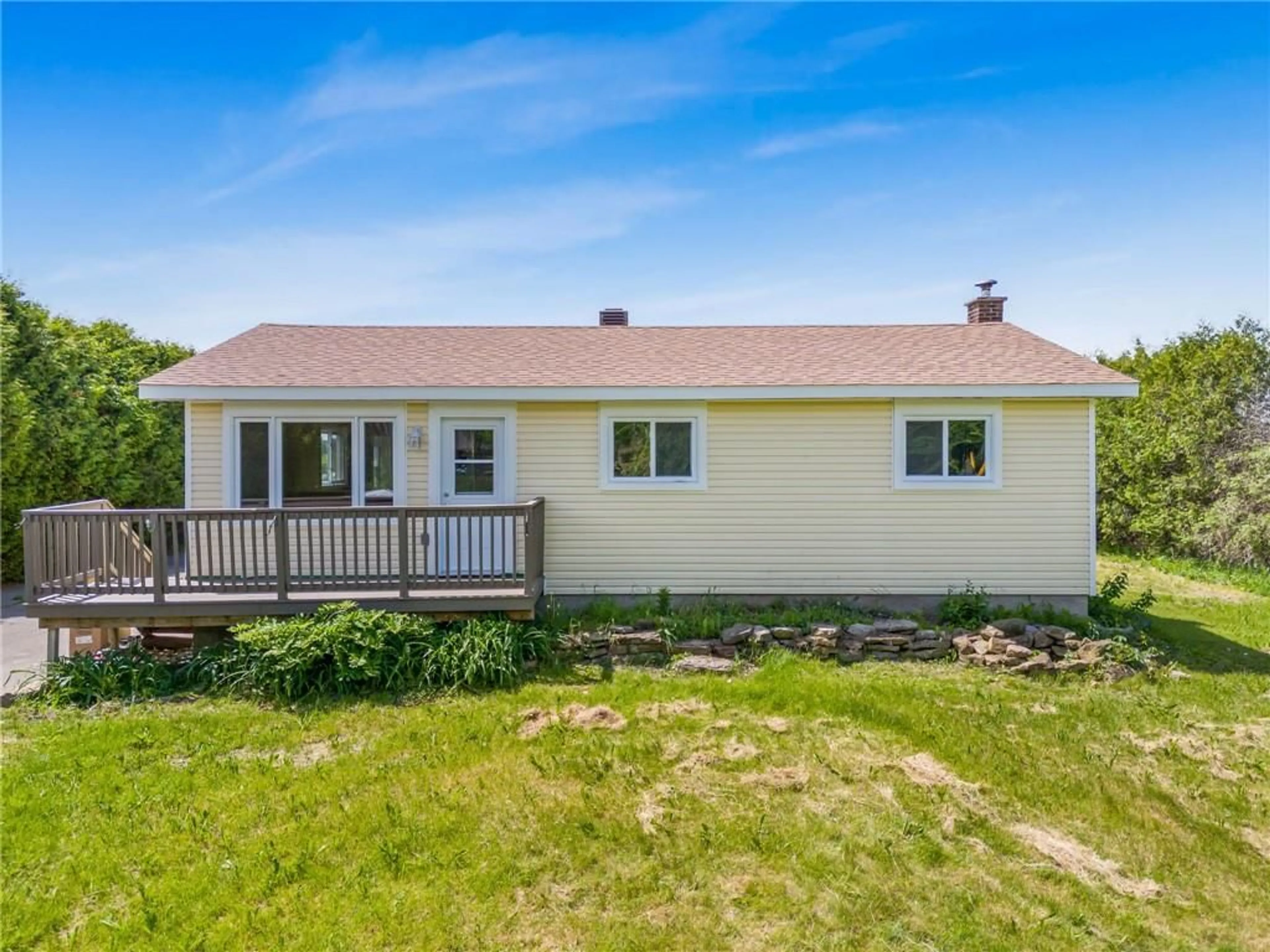 Frontside or backside of a home, the fenced backyard for 590 COUNTY RD 10 Rd, St Eugene Ontario K0B 1P0