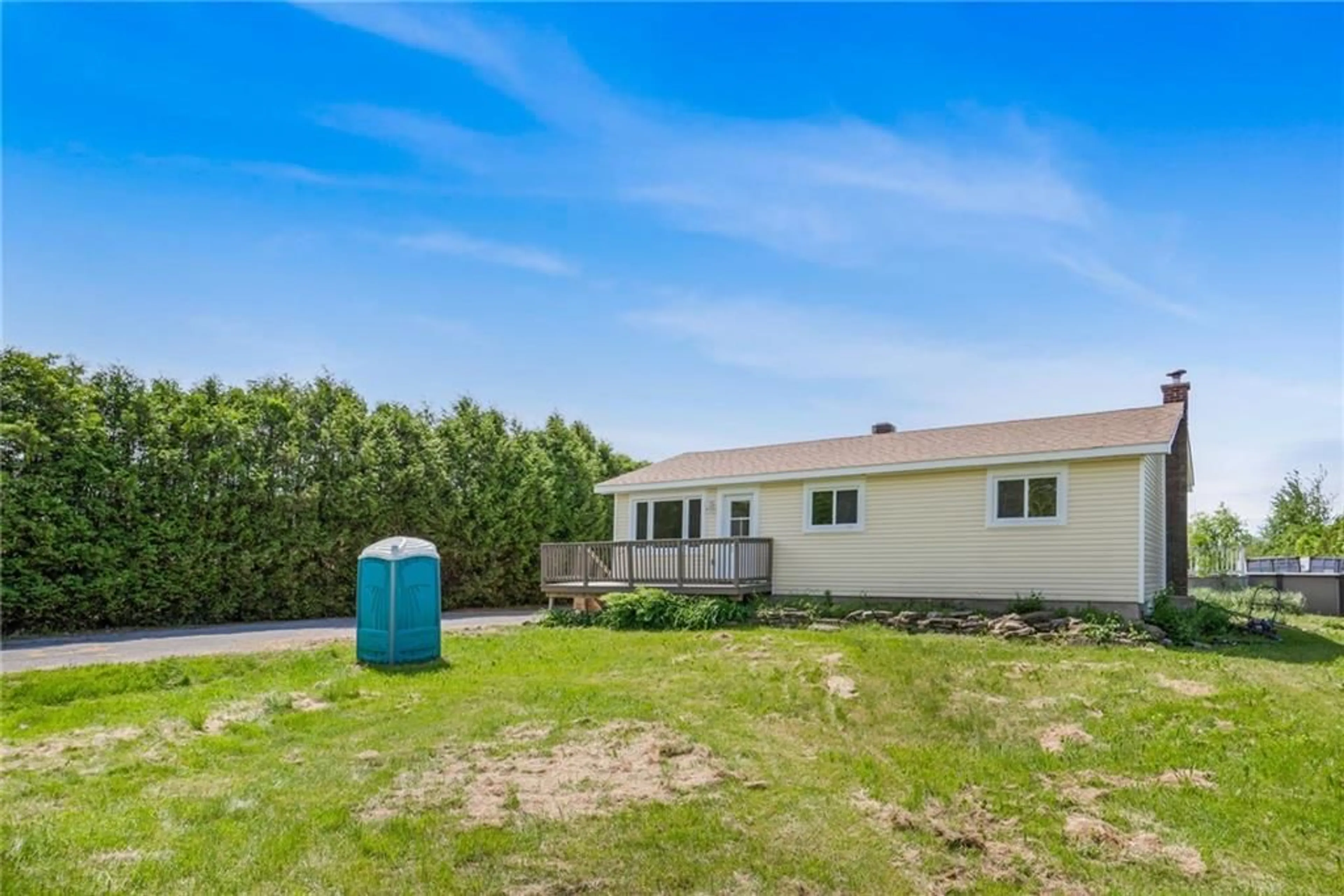 Frontside or backside of a home, the fenced backyard for 590 COUNTY RD 10 Rd, St Eugene Ontario K0B 1P0