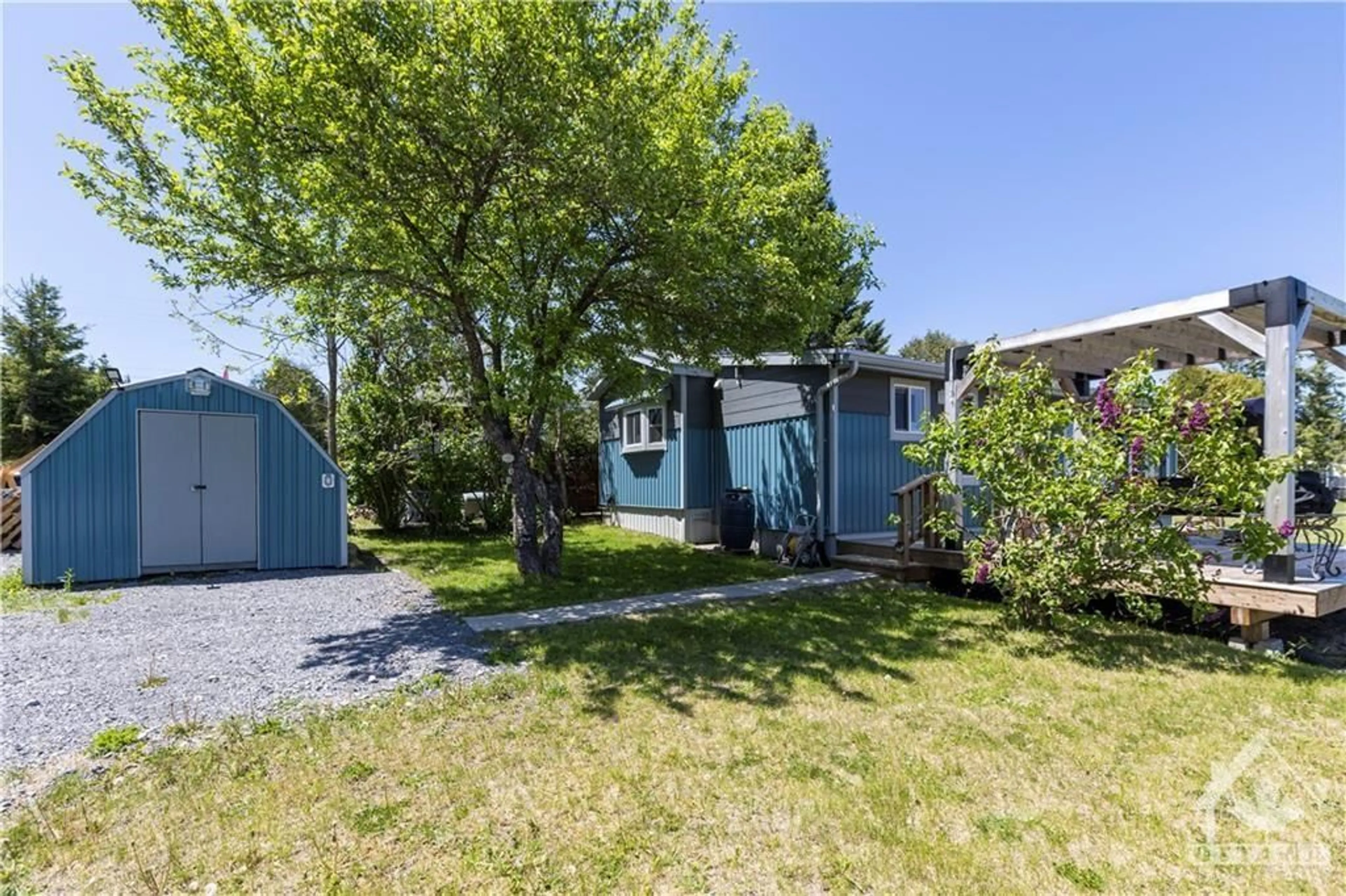 A pic from exterior of the house or condo, the fenced backyard for 7 STRICKLAND Pvt, Ottawa Ontario K0A 1B0