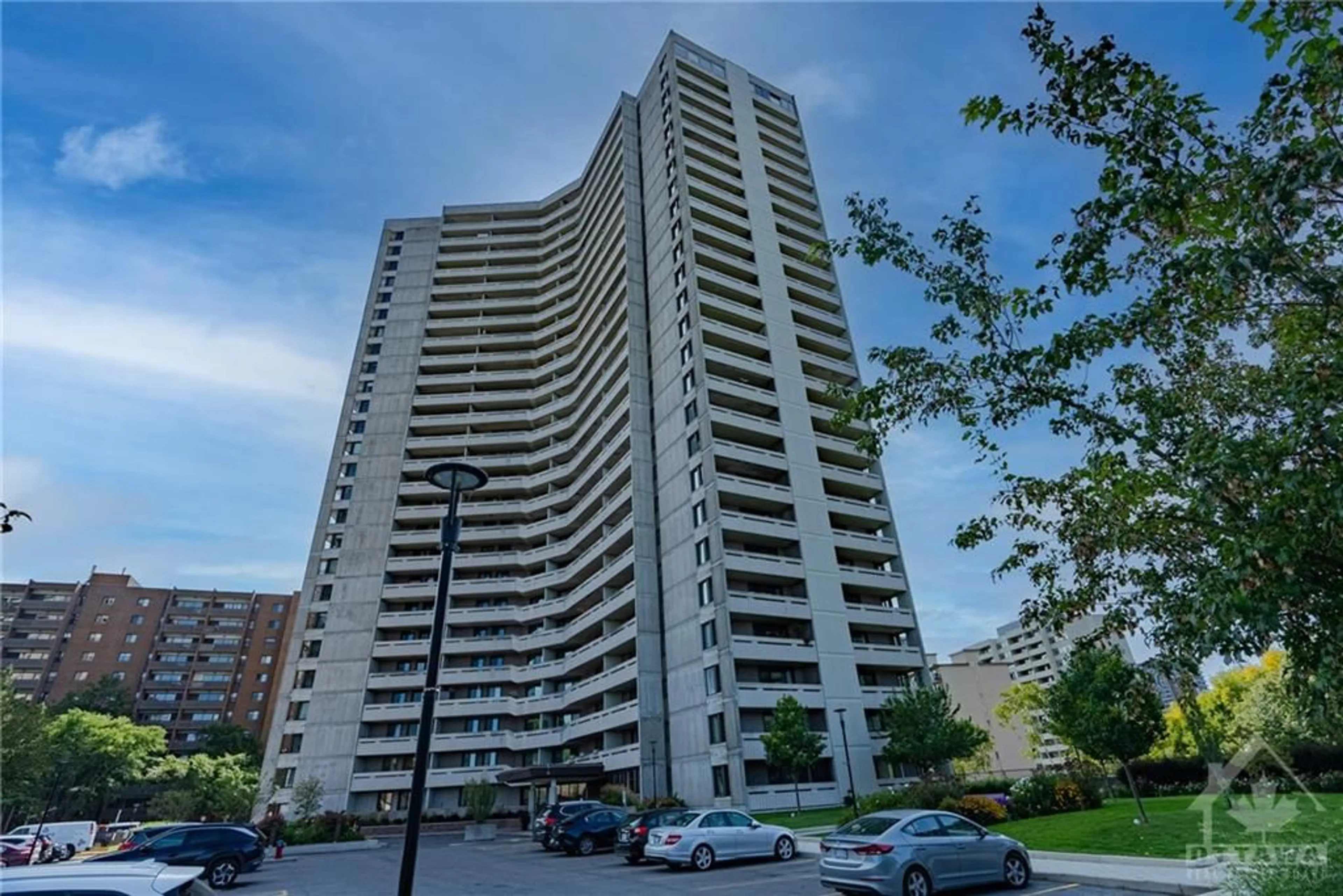 A pic from exterior of the house or condo, the street view for 1171 AMBLESIDE Dr #1108, Ottawa Ontario K2B 8E1