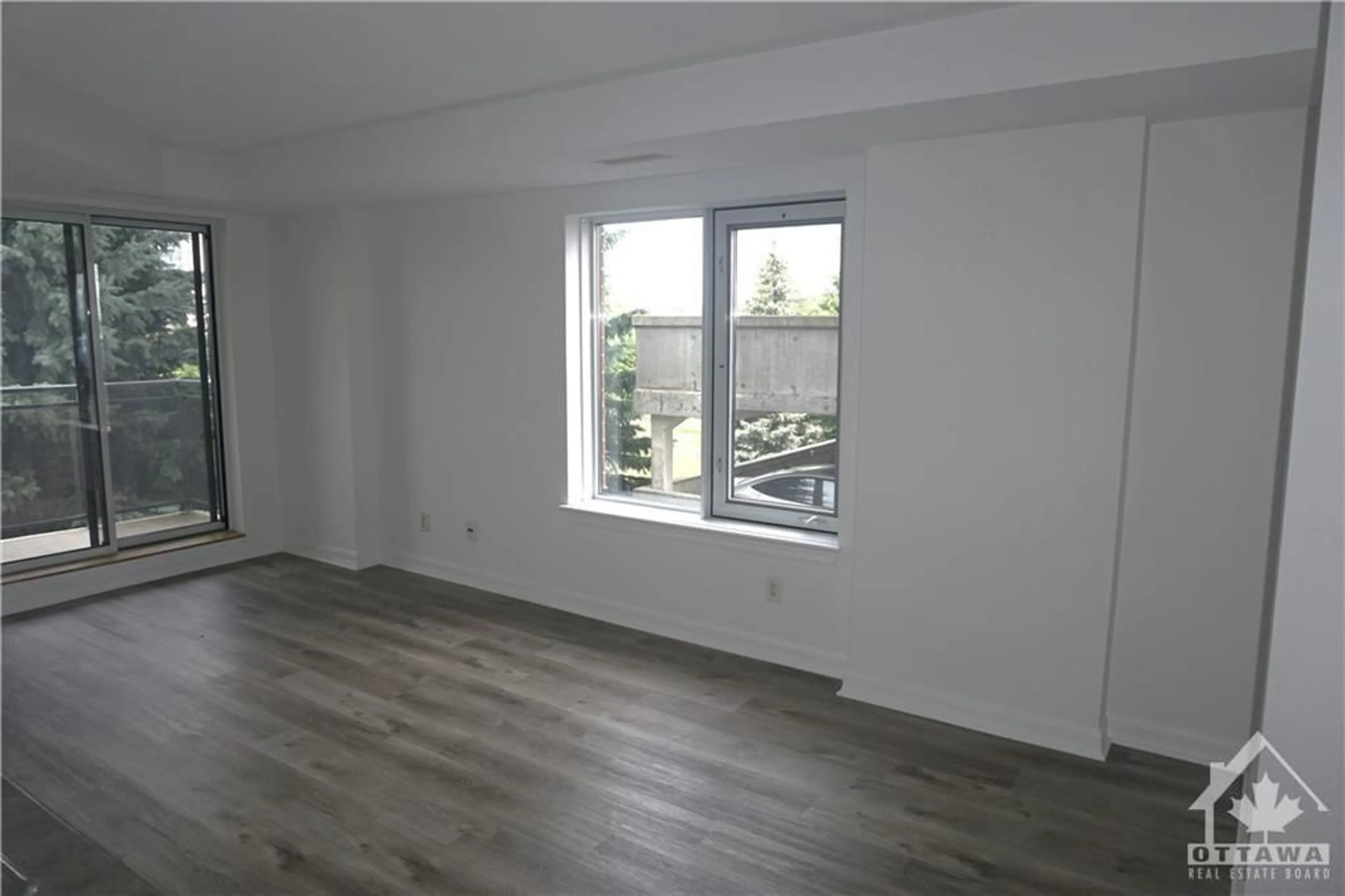 A pic of a room, wood floors for 310 CENTRAL PARK Dr #3F, Ottawa Ontario K2C 4G4