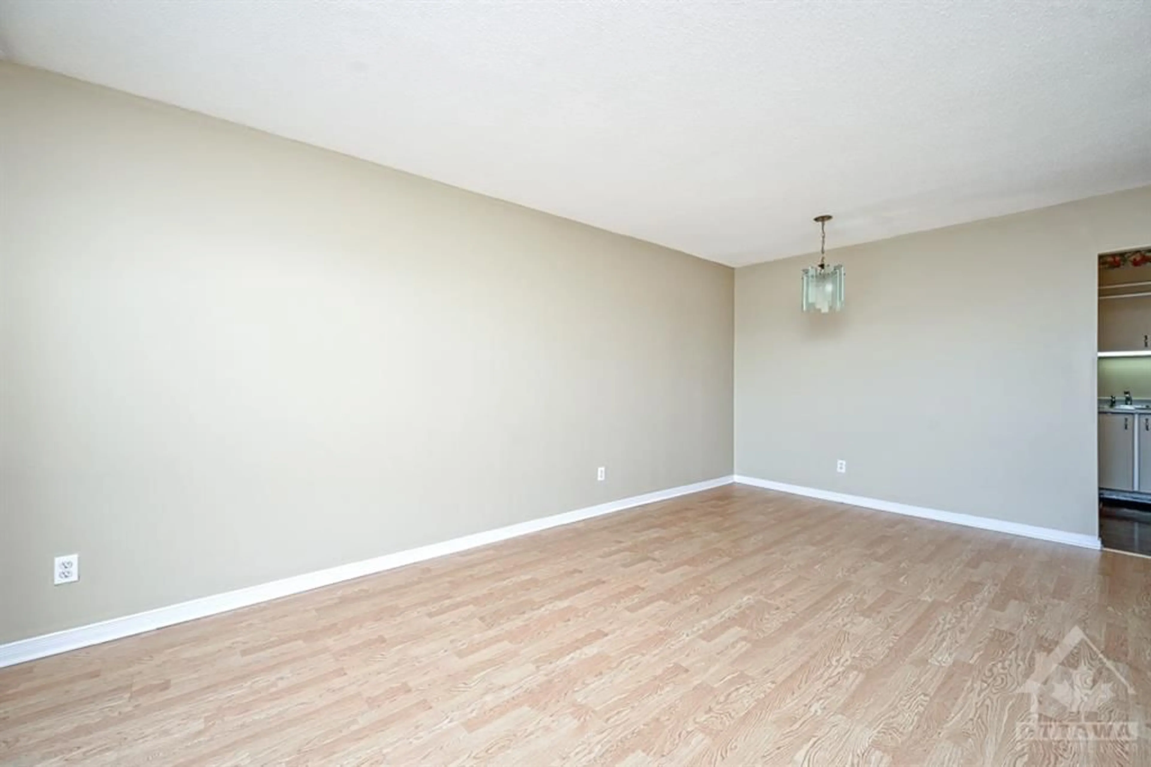 A pic of a room, wood floors for 158C MCARTHUR Ave #903, Ottawa Ontario K1L 8E7