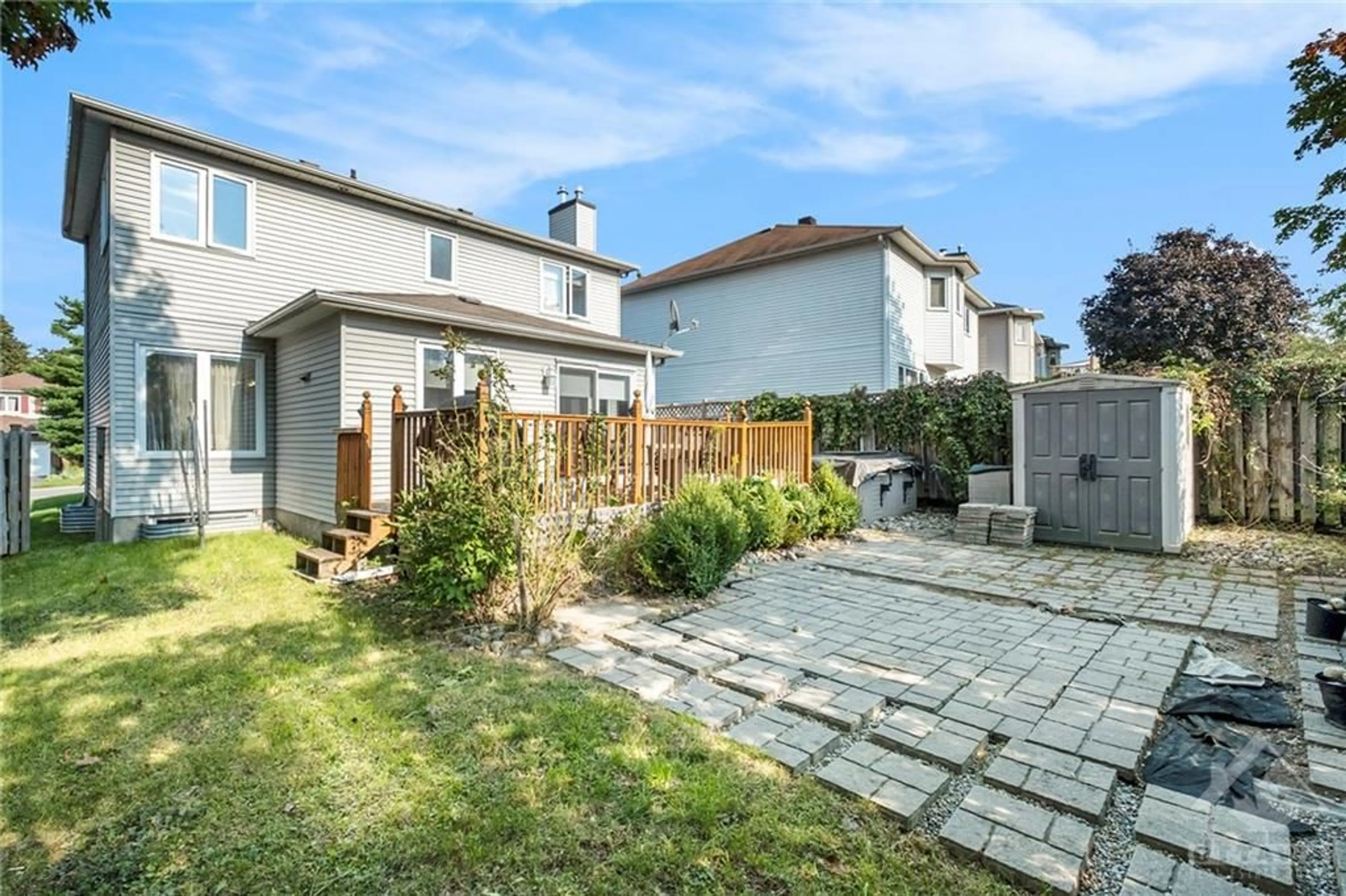 Frontside or backside of a home, the fenced backyard for 228 MCGIBBON Dr, Kanata Ontario K2L 3Y5