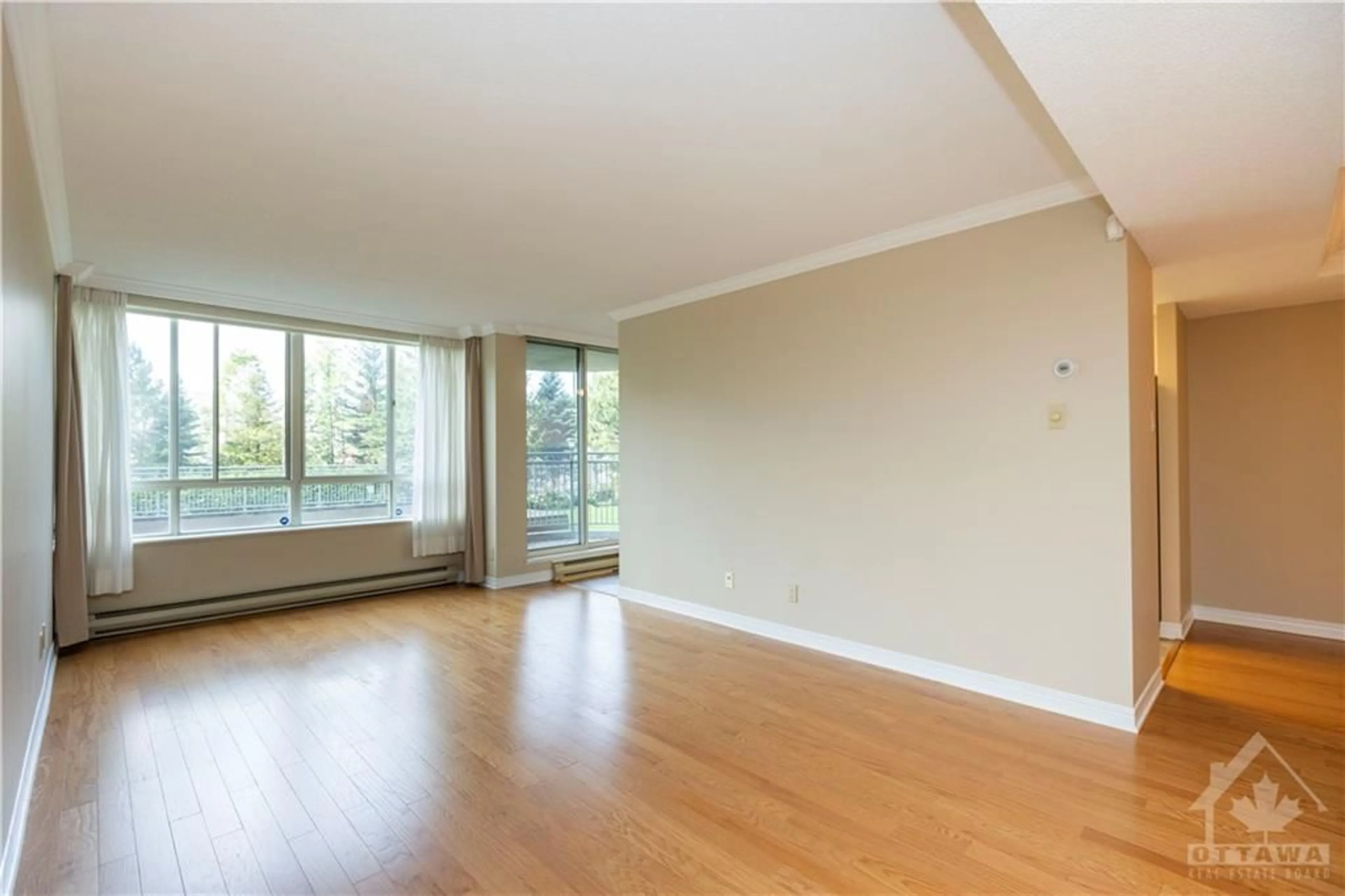 A pic of a room, wood floors for 100 GRANT CARMAN Dr #116, Ottawa Ontario K2E 8B8