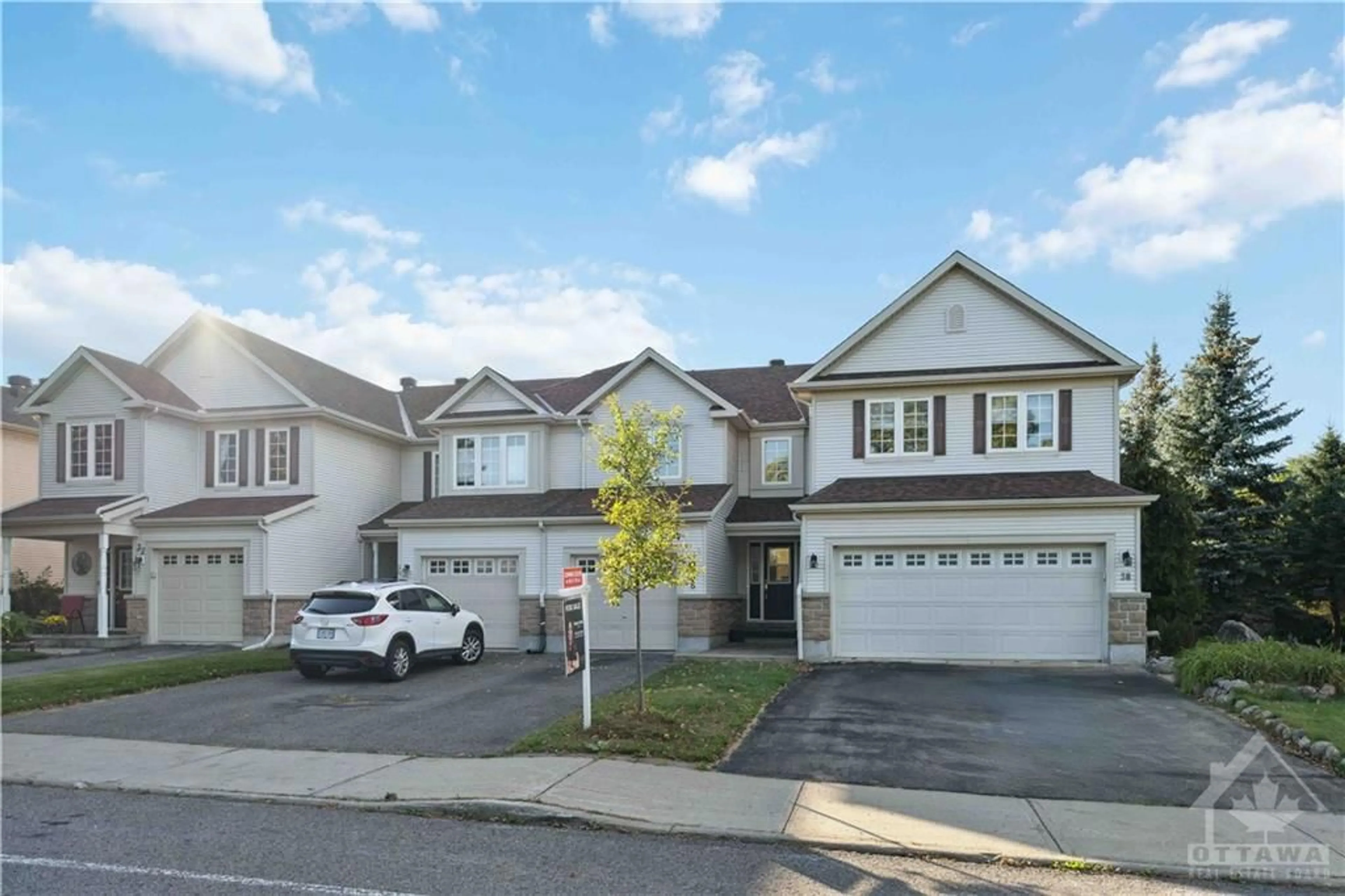 A pic from exterior of the house or condo, the street view for 36 RIVERSTONE Dr, Barrhaven Ontario K2J 4X7