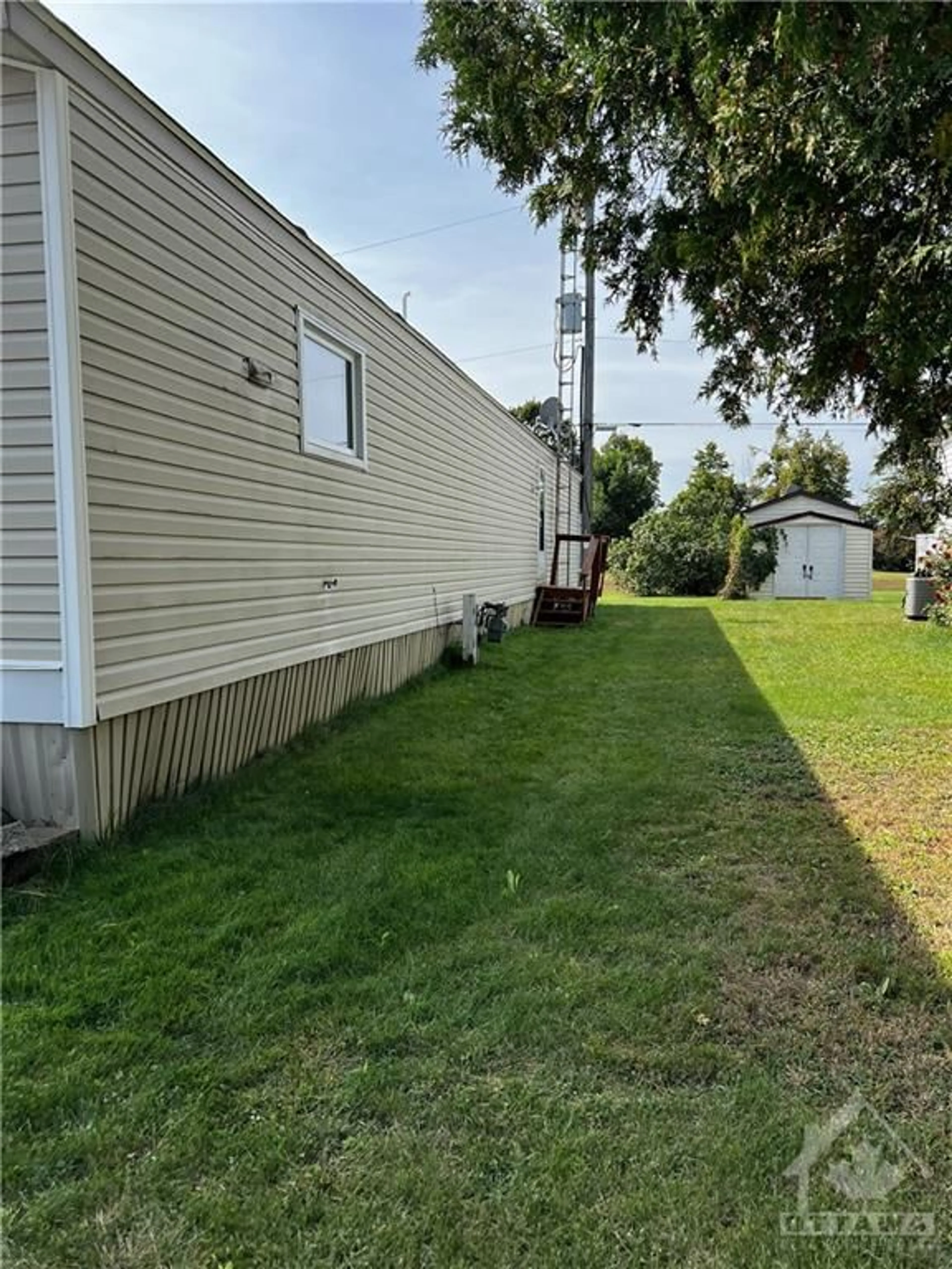 Frontside or backside of a home, the fenced backyard for 247 PARK Cres, Carleton Place Ontario K7C 4R5