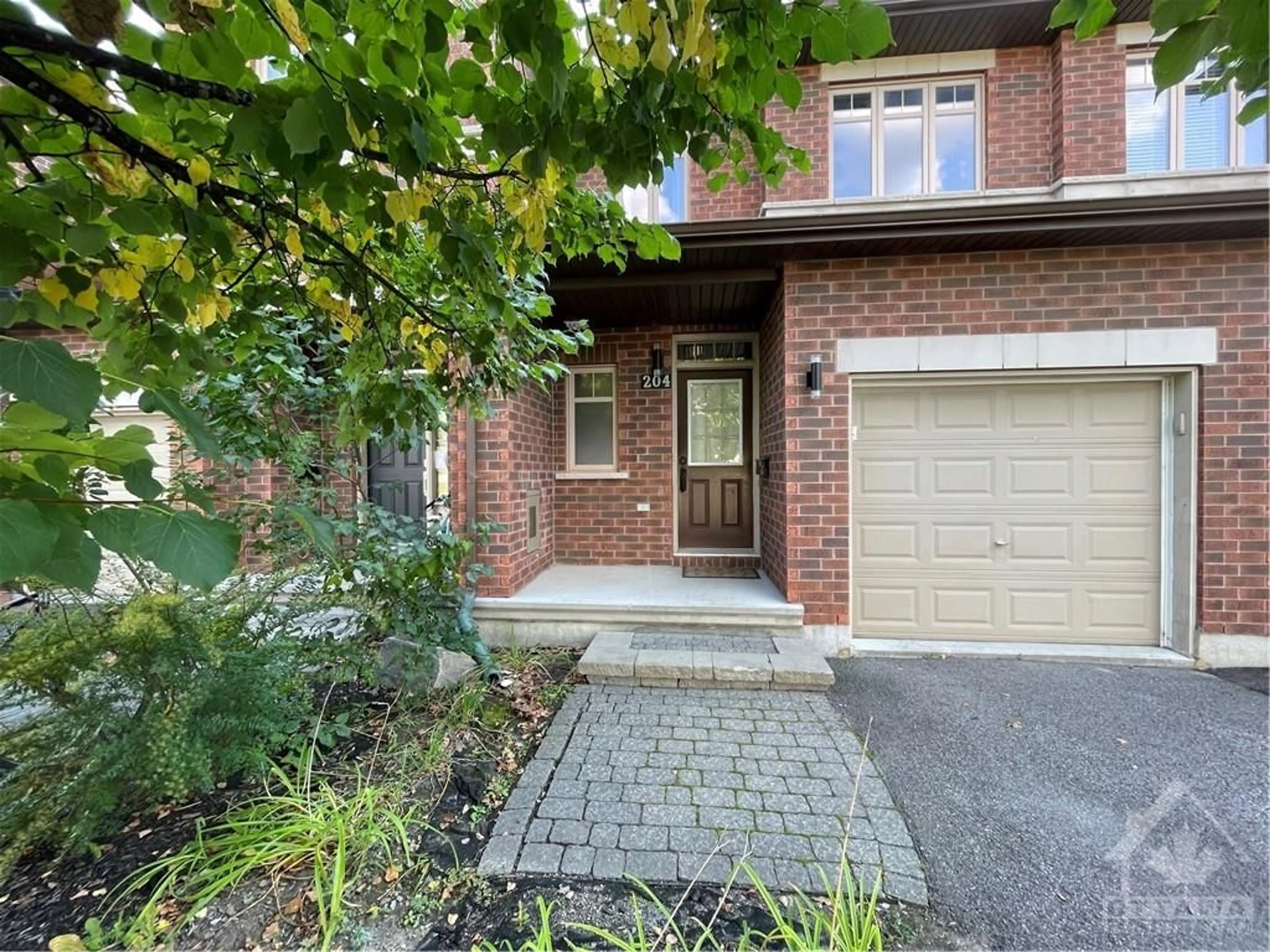 Home with brick exterior material for 204 BADGELEY Ave, Ottawa Ontario K2T 0A4