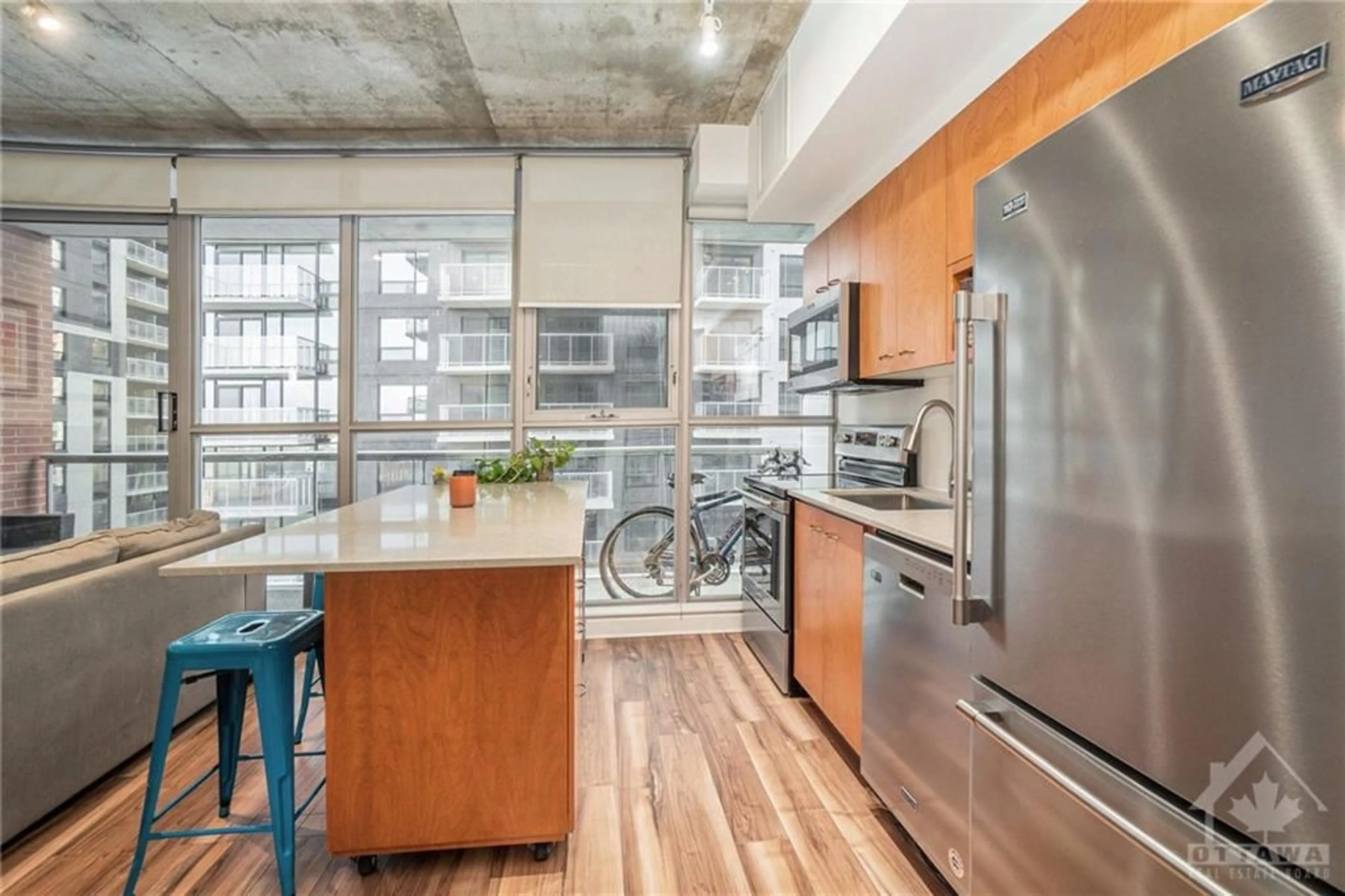 Kitchen with laundary machines, wood floors for 179 GEORGE St #704, Ottawa Ontario K1N 1J8