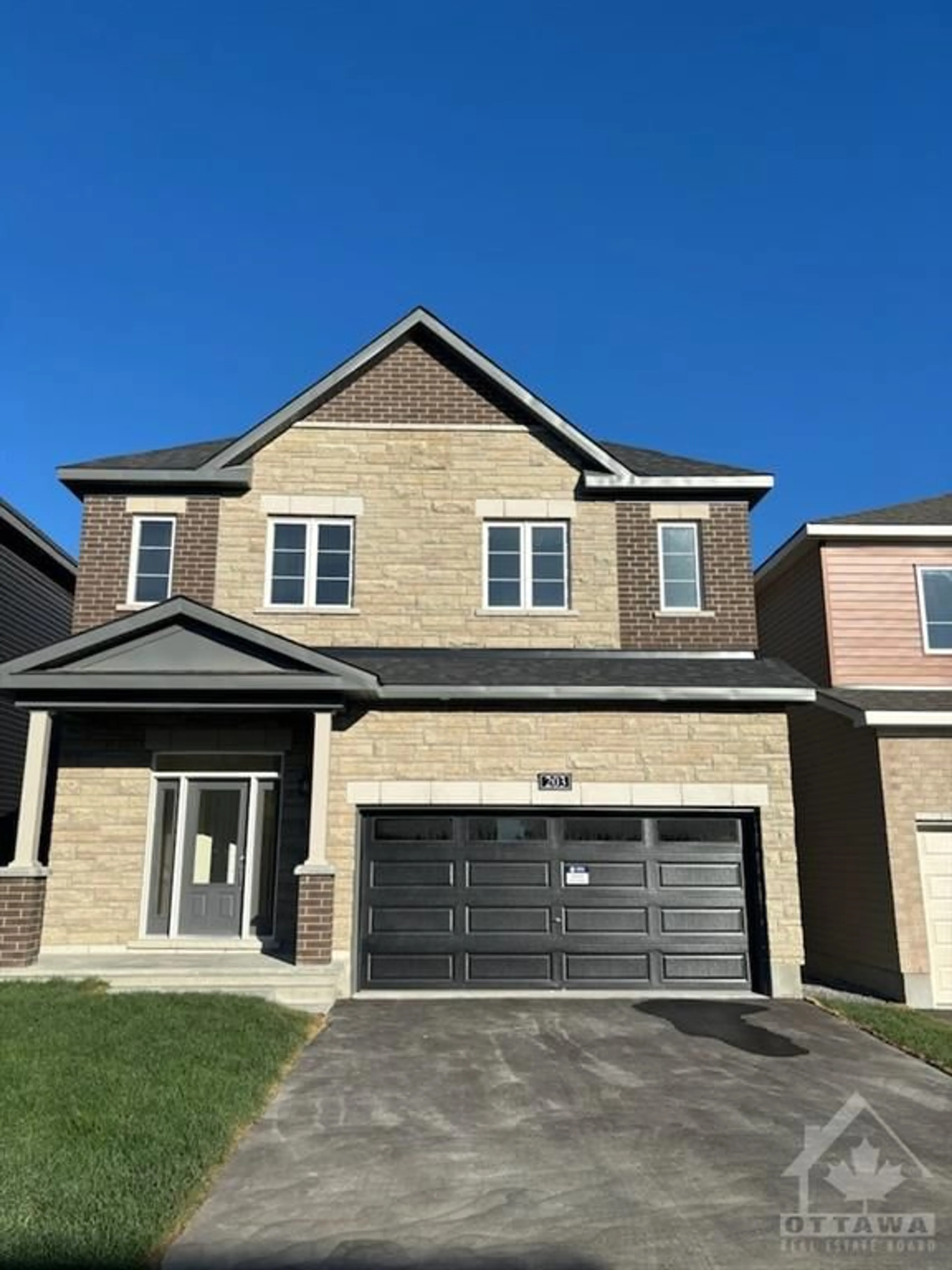 Home with brick exterior material for 203 ELSIE MACGILL Walk, Ottawa Ontario K2W 0L5