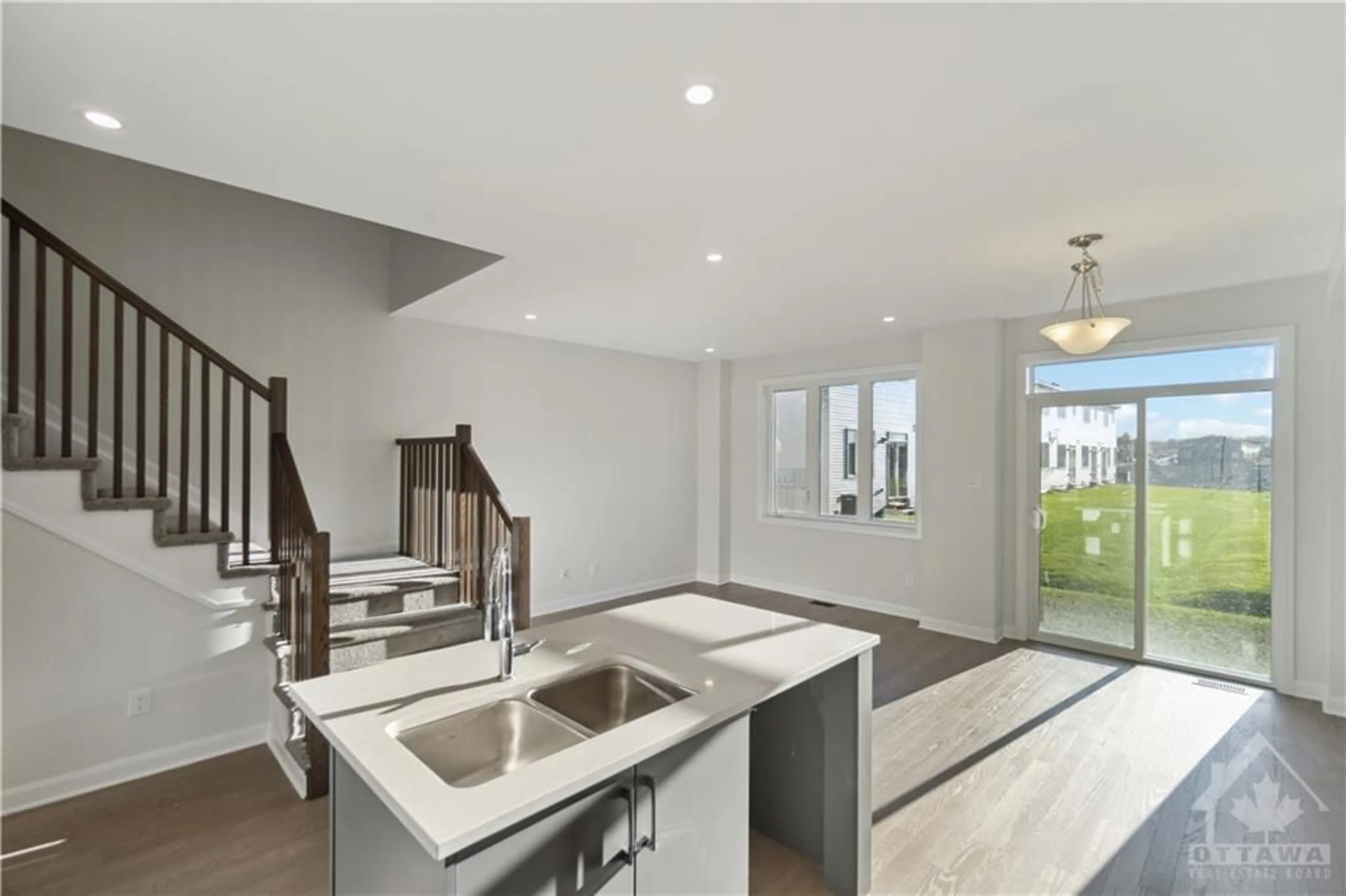 Open concept kitchen for 304 ELSIE MACGILL Walk, Ottawa Ontario K2W 0L1