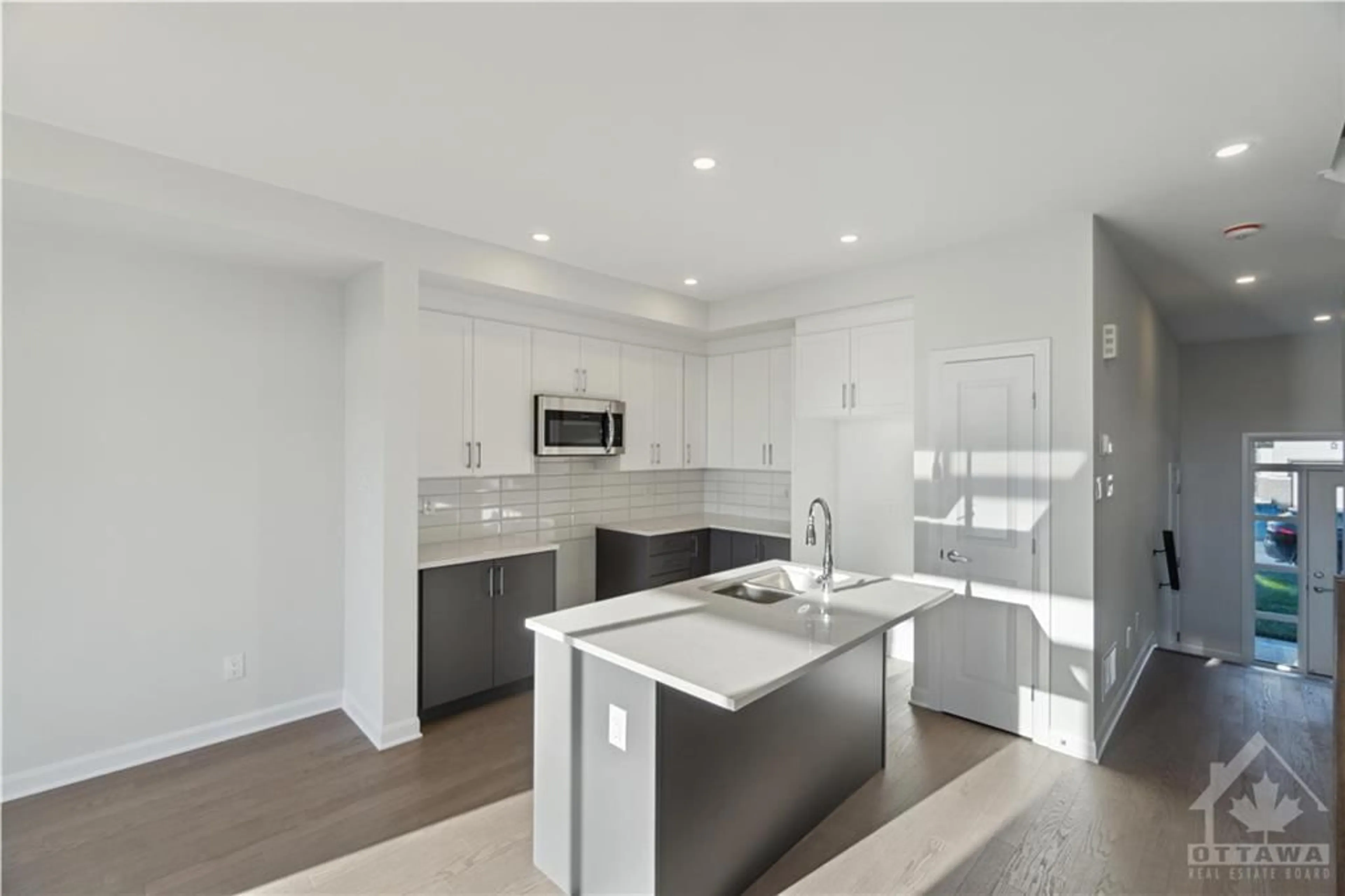 Open concept kitchen for 304 ELSIE MACGILL Walk, Ottawa Ontario K2W 0L1