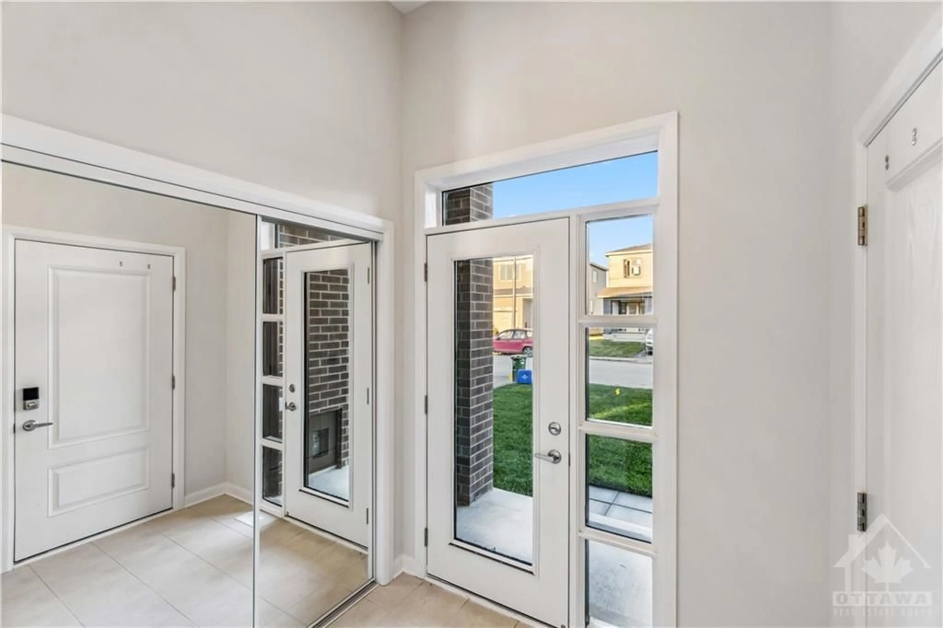 Indoor entryway, wood floors for 302 ELSIE MACGILL Walk, Ottawa Ontario K2W 0L1