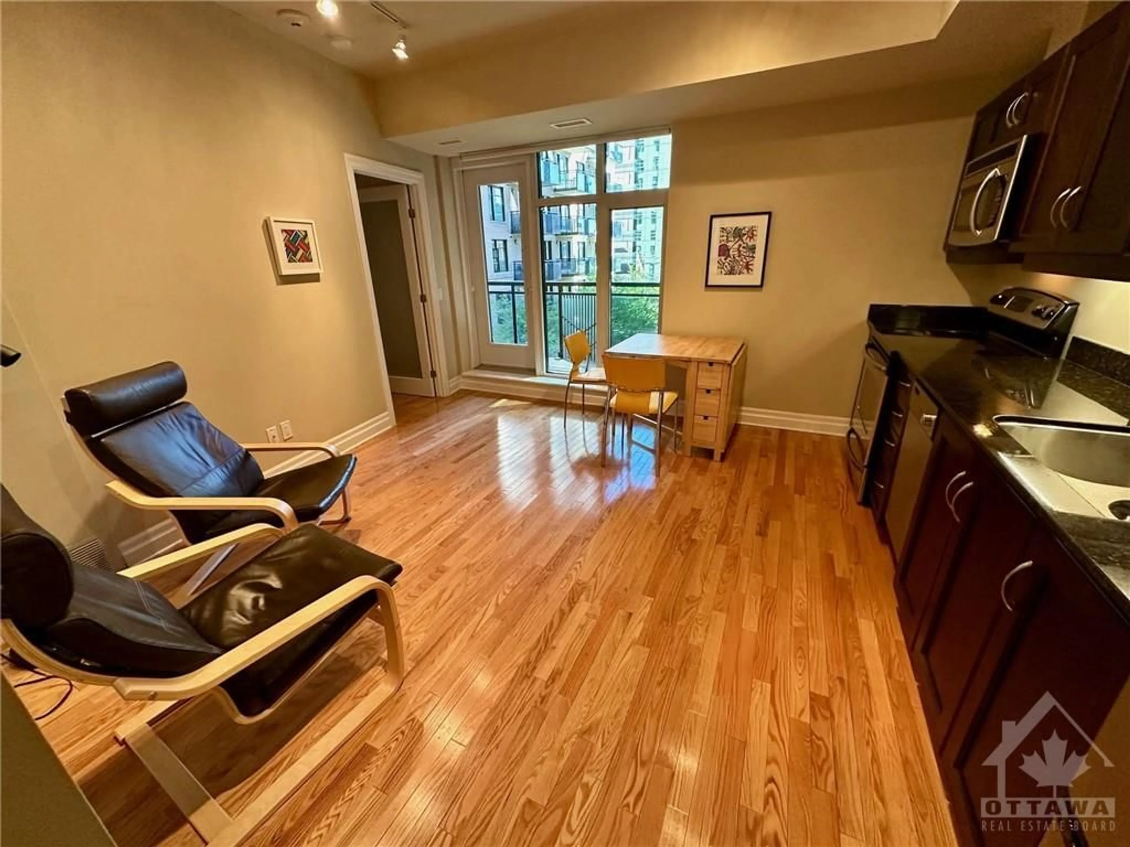 A pic of a room, wood floors for 245 KENT St #407, Ottawa Ontario K2P 0A5