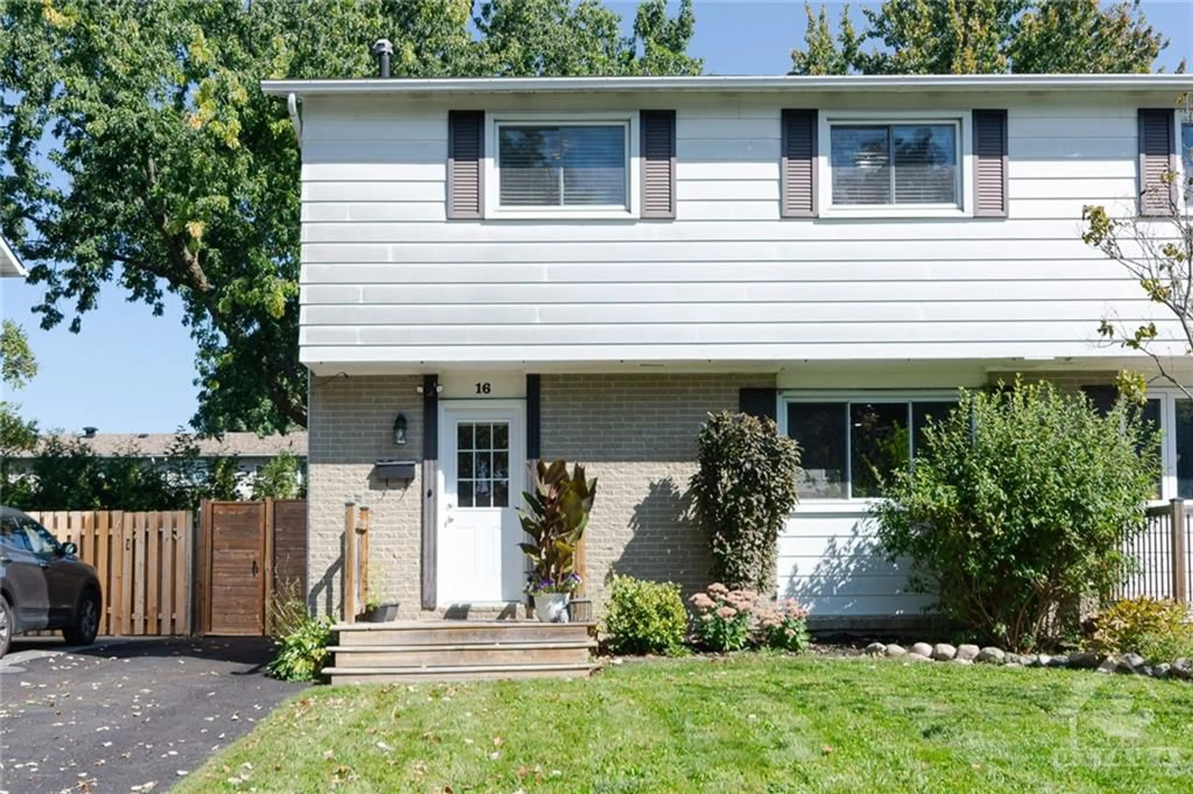 A pic from exterior of the house or condo, the fenced backyard for 16 SHOULDICE Cres, Ottawa Ontario K2L 1M9