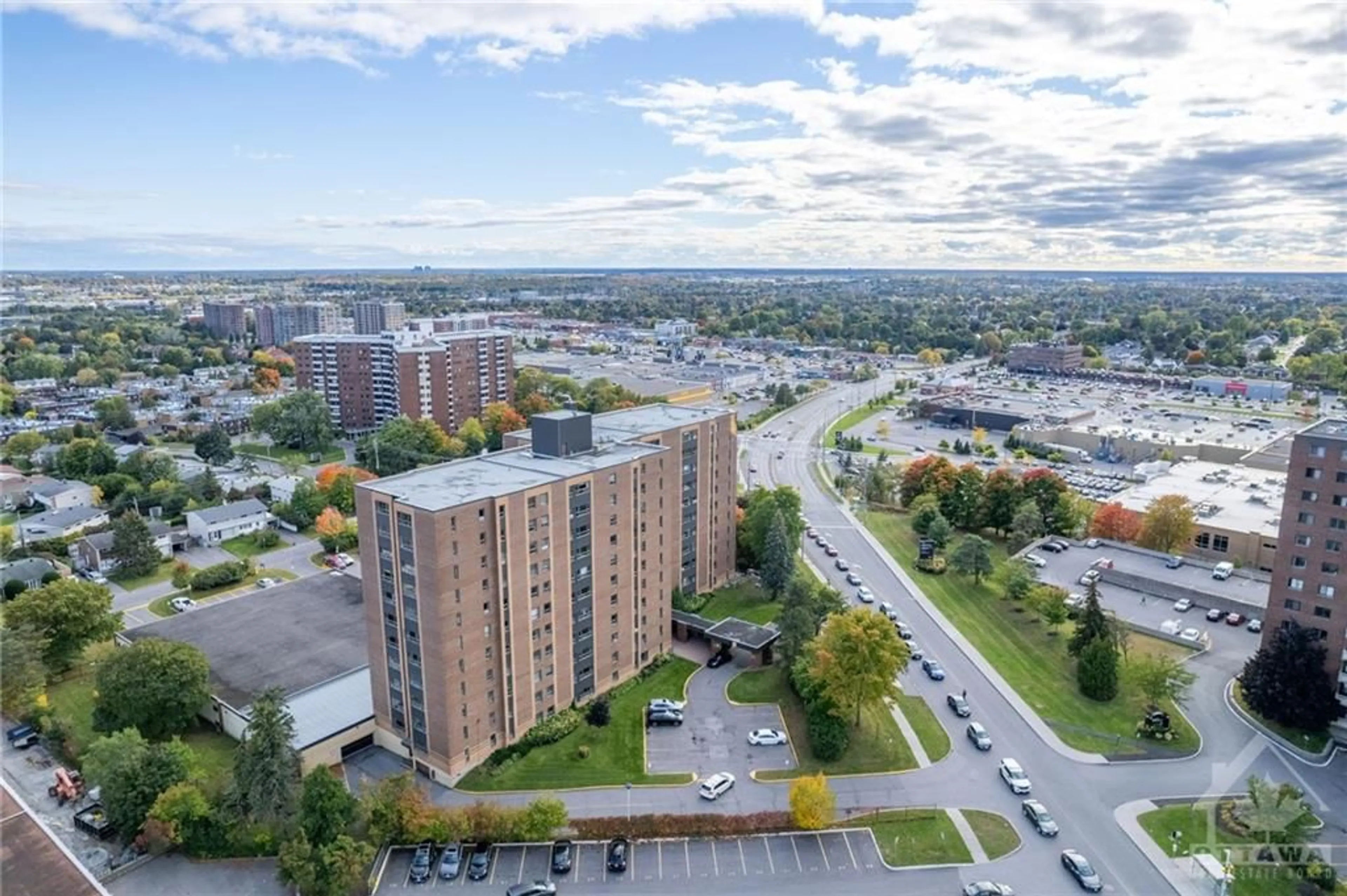 A pic from exterior of the house or condo, the view of city buildings for 1356 MEADOWLANDS Dr #1007, Ottawa Ontario K2E 6K6